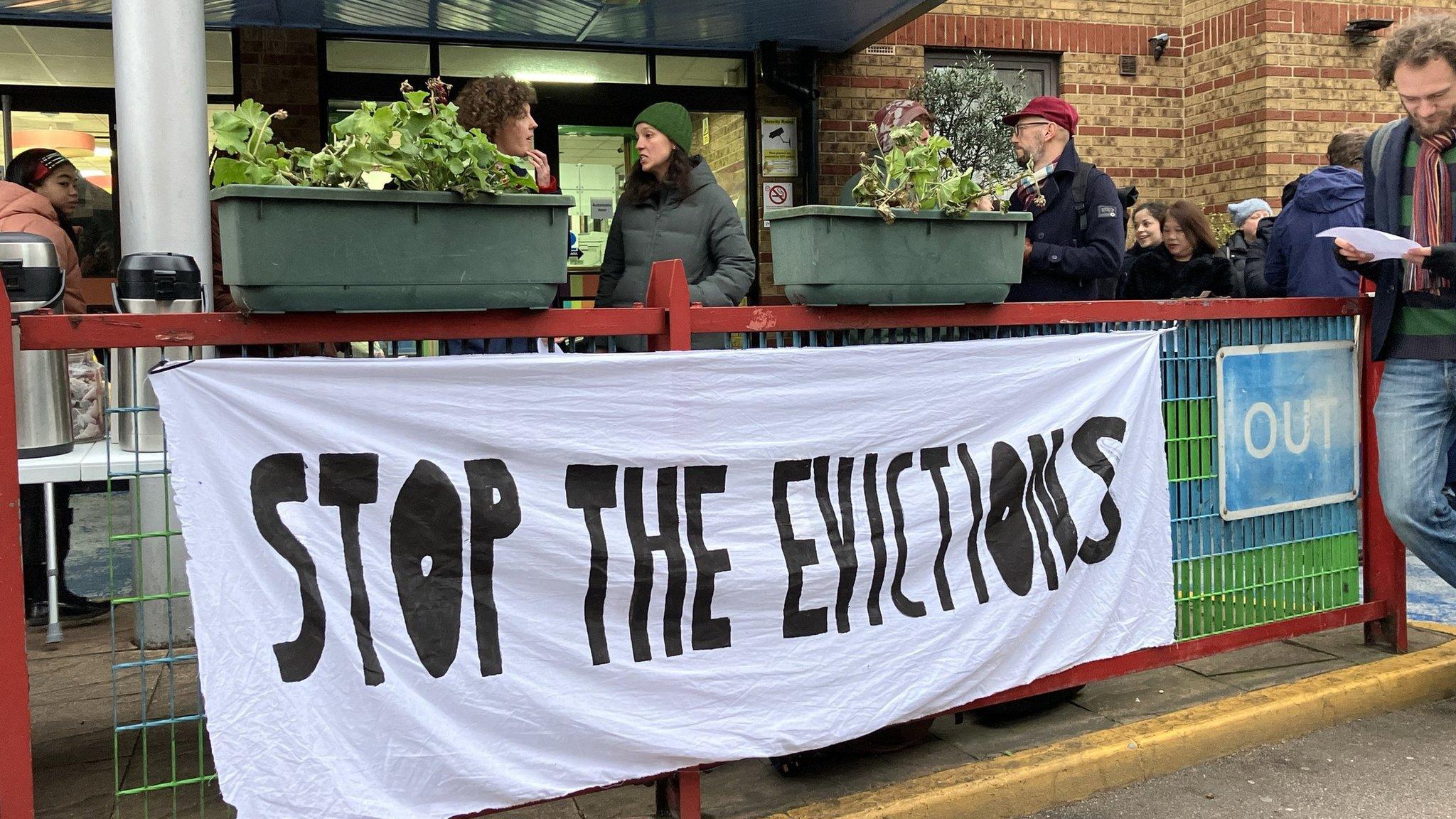 Protesters gather outside the hotel on Thursday morning