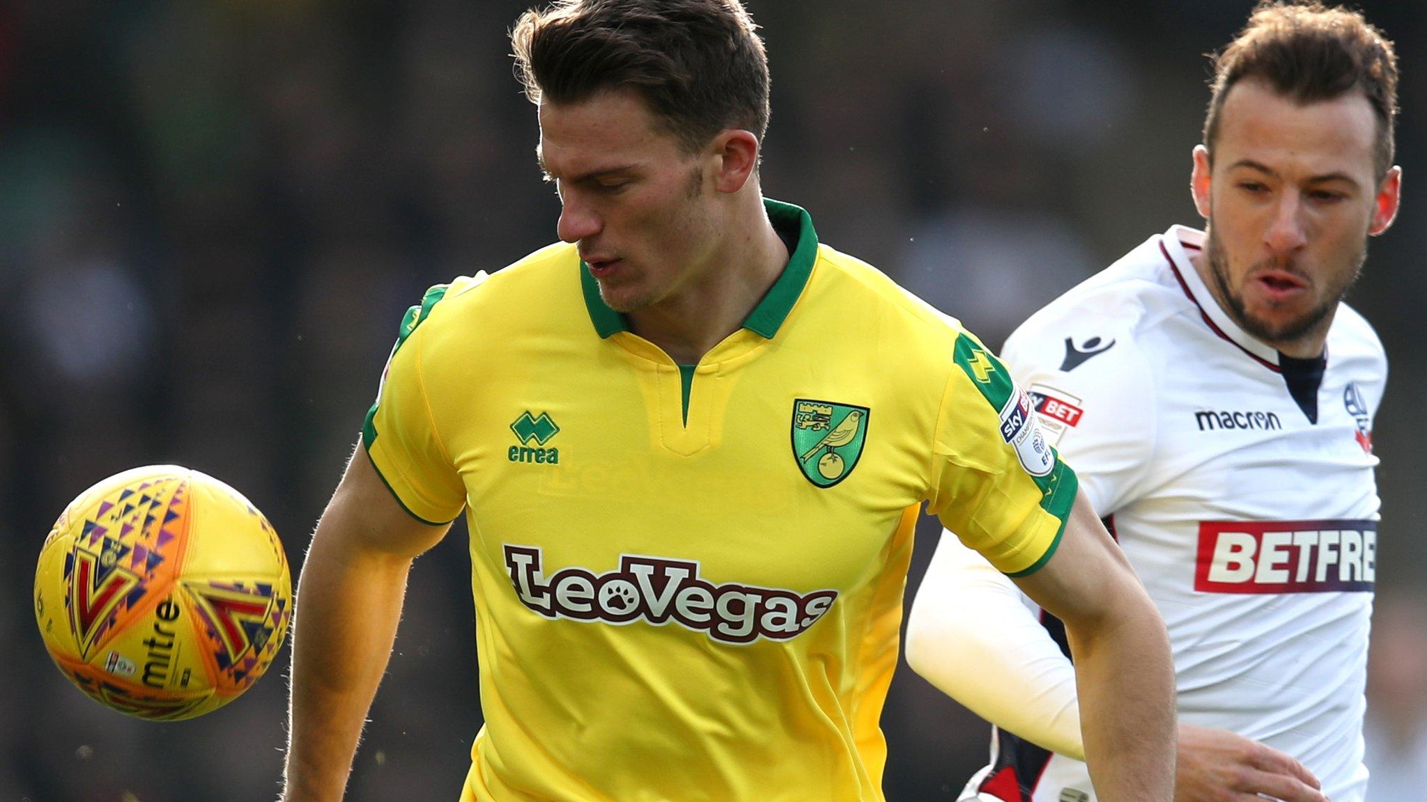 orwich City's Christophe Zimmermann and Bolton Wanderers' Adam Le Fondre battle for the ball