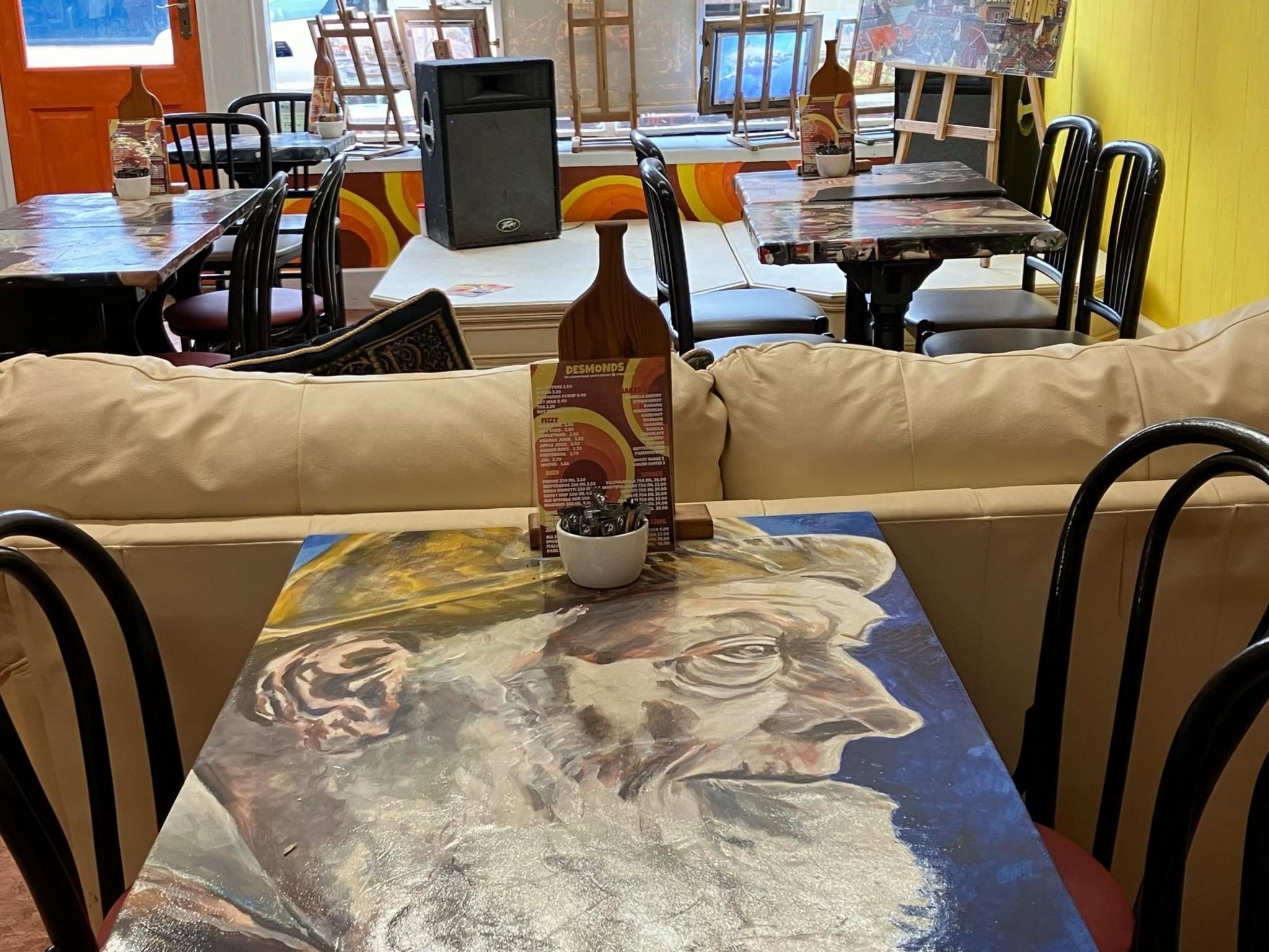 Table with artwork on its surface at Desmonds, Lowestoft