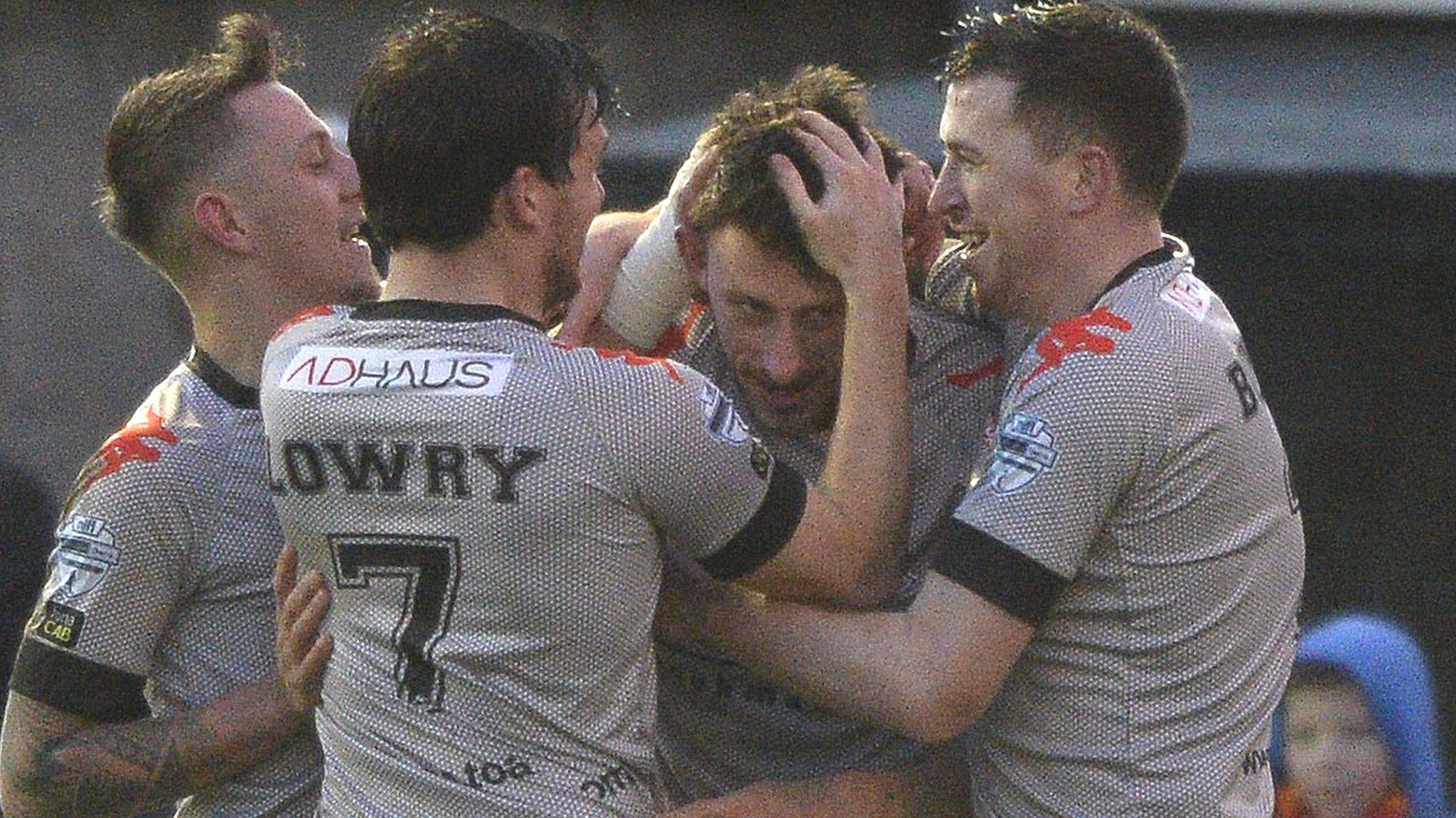 Crrusaders celebrate Jordan Forsythe's opener against Ballinamallard