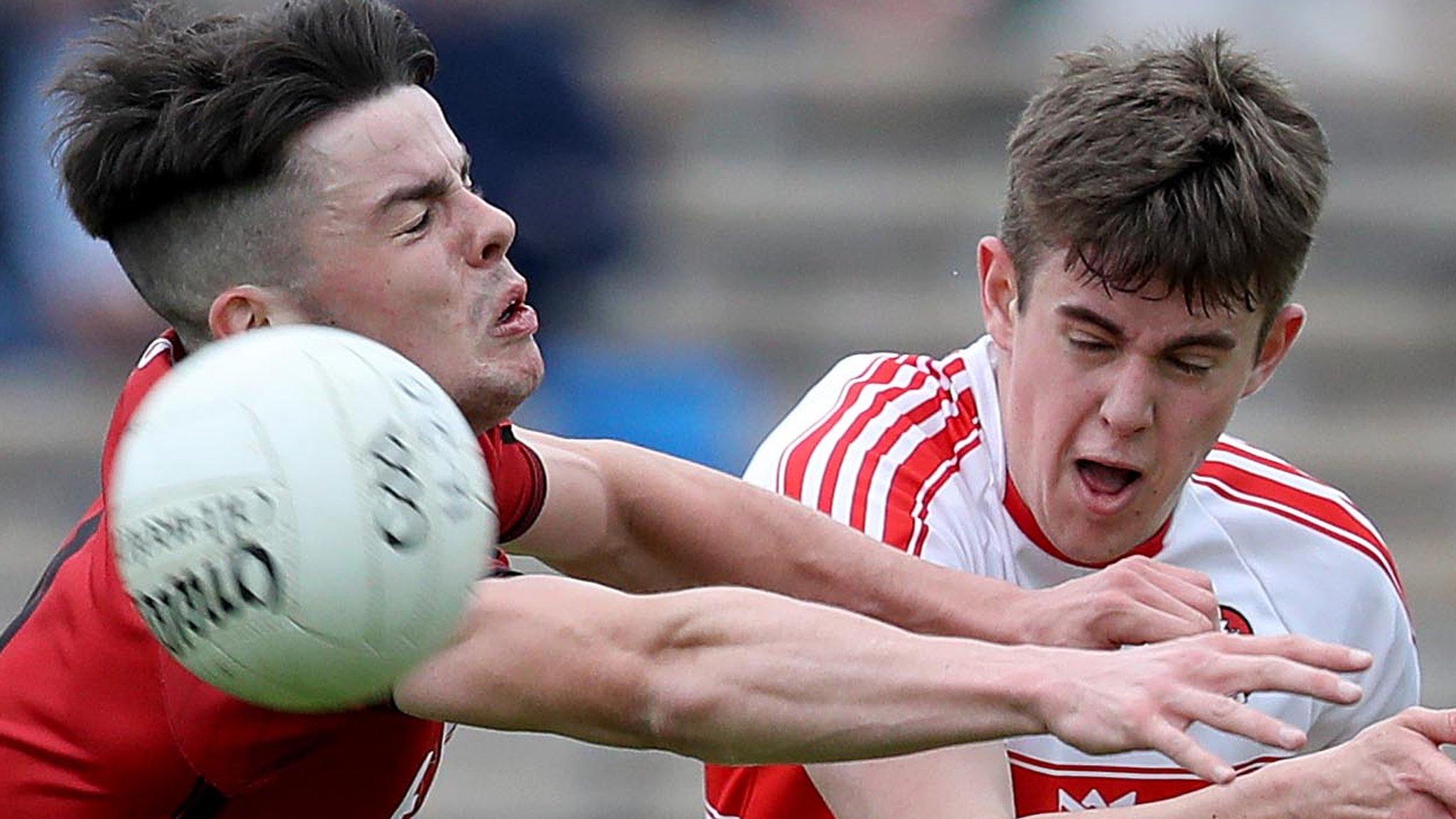 Down's Adam Lynch challenges Lorcan McWilliams of Derry