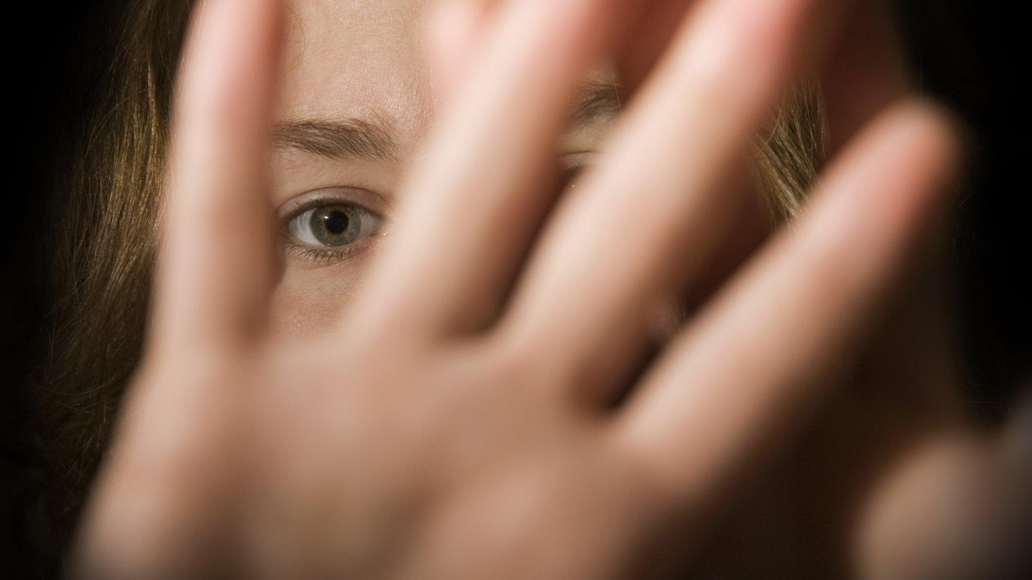 Stock picture of woman defending herself from an attacker