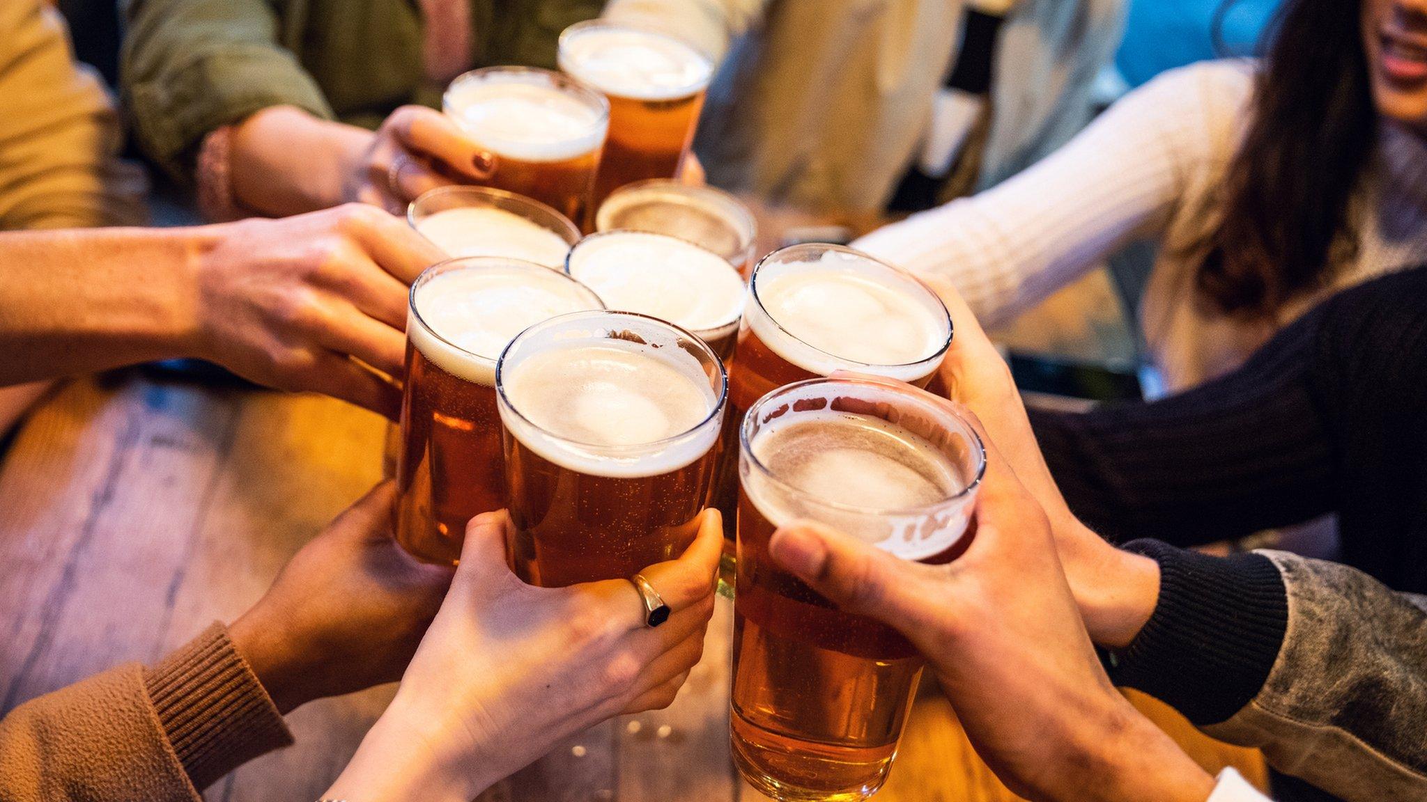 People holding pints