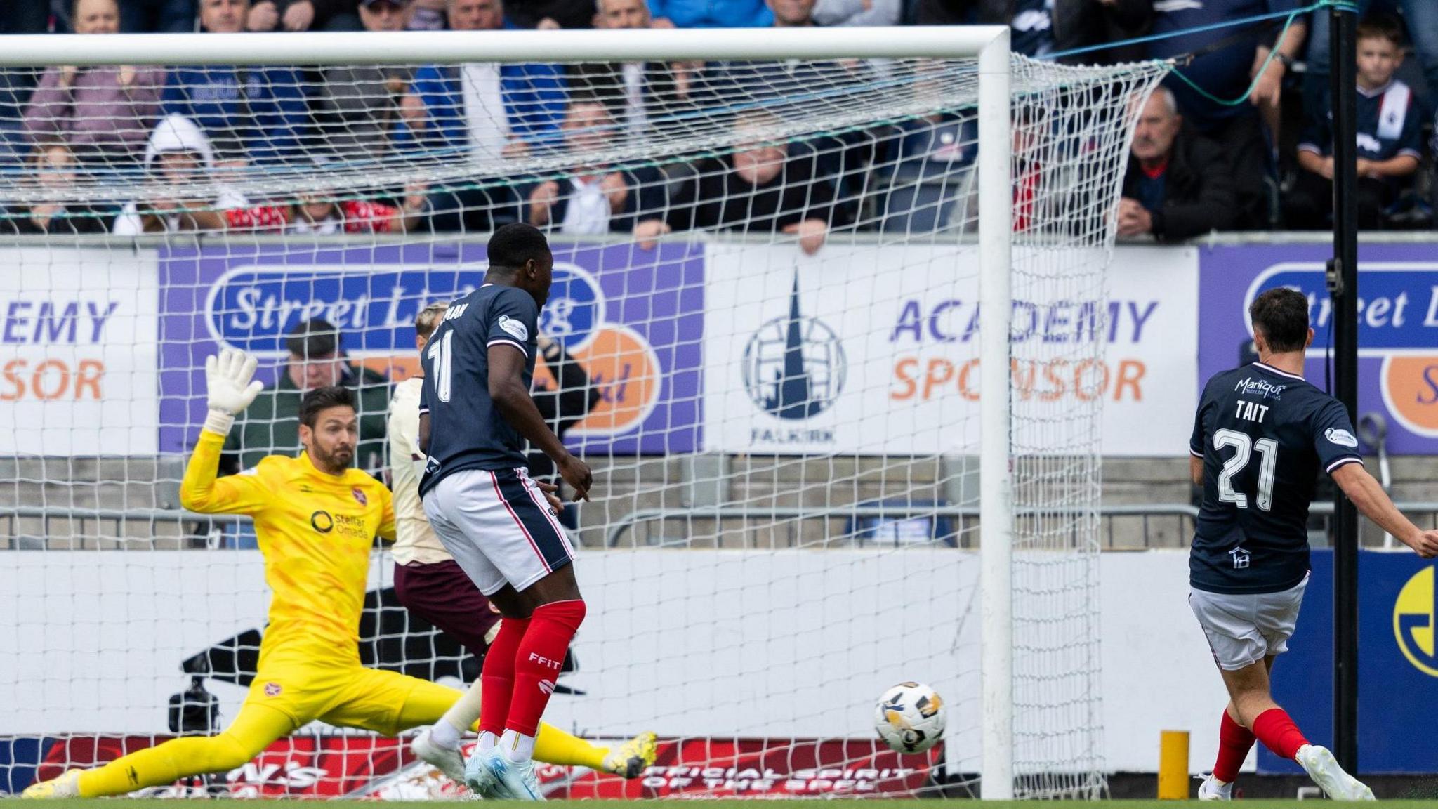 Falkirk's Dylan Tait scores against Hearts