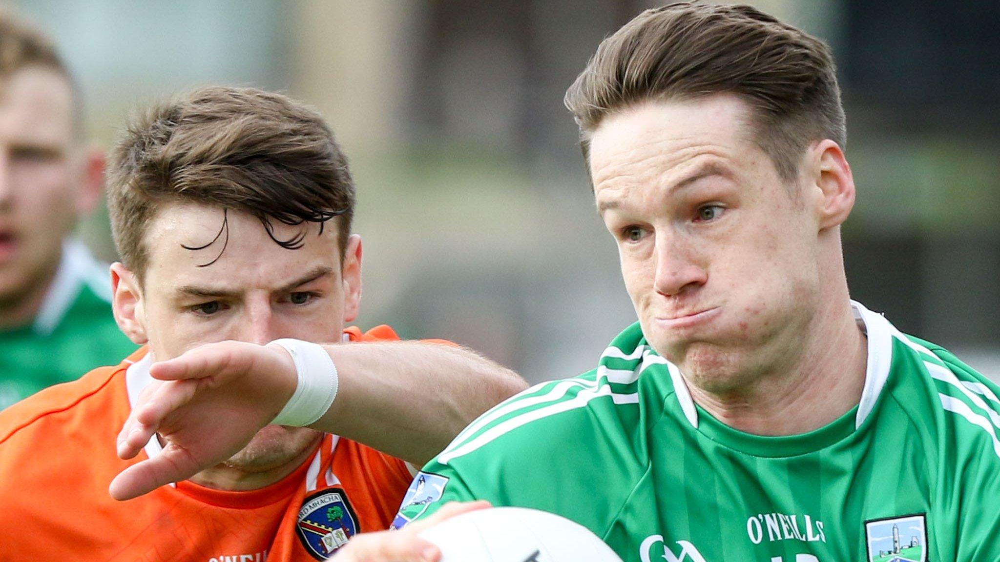 Armagh's Niall Grimley and Fermanagh's Tomas Corrigan