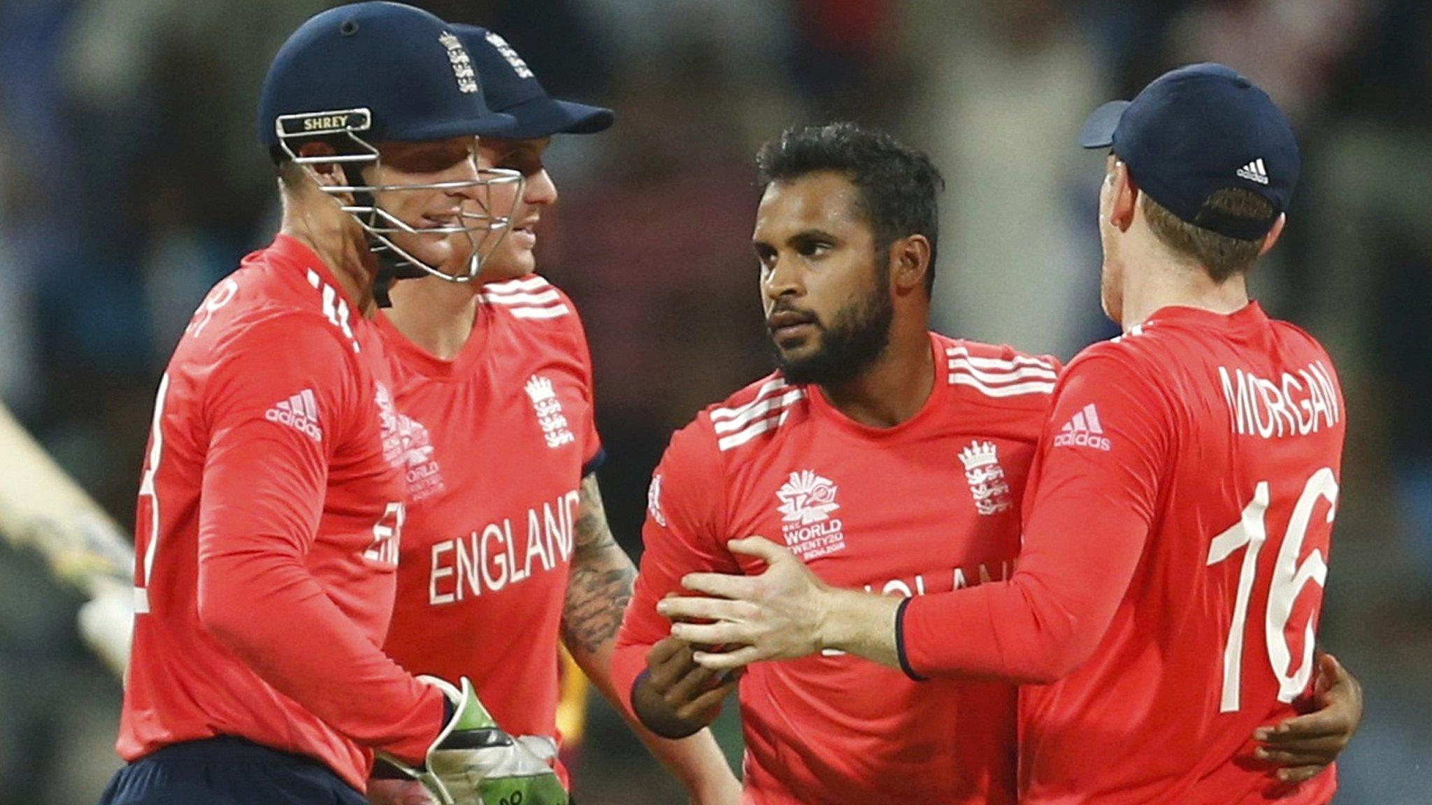 England celebrate a wicket by Adil Rashid (centre)