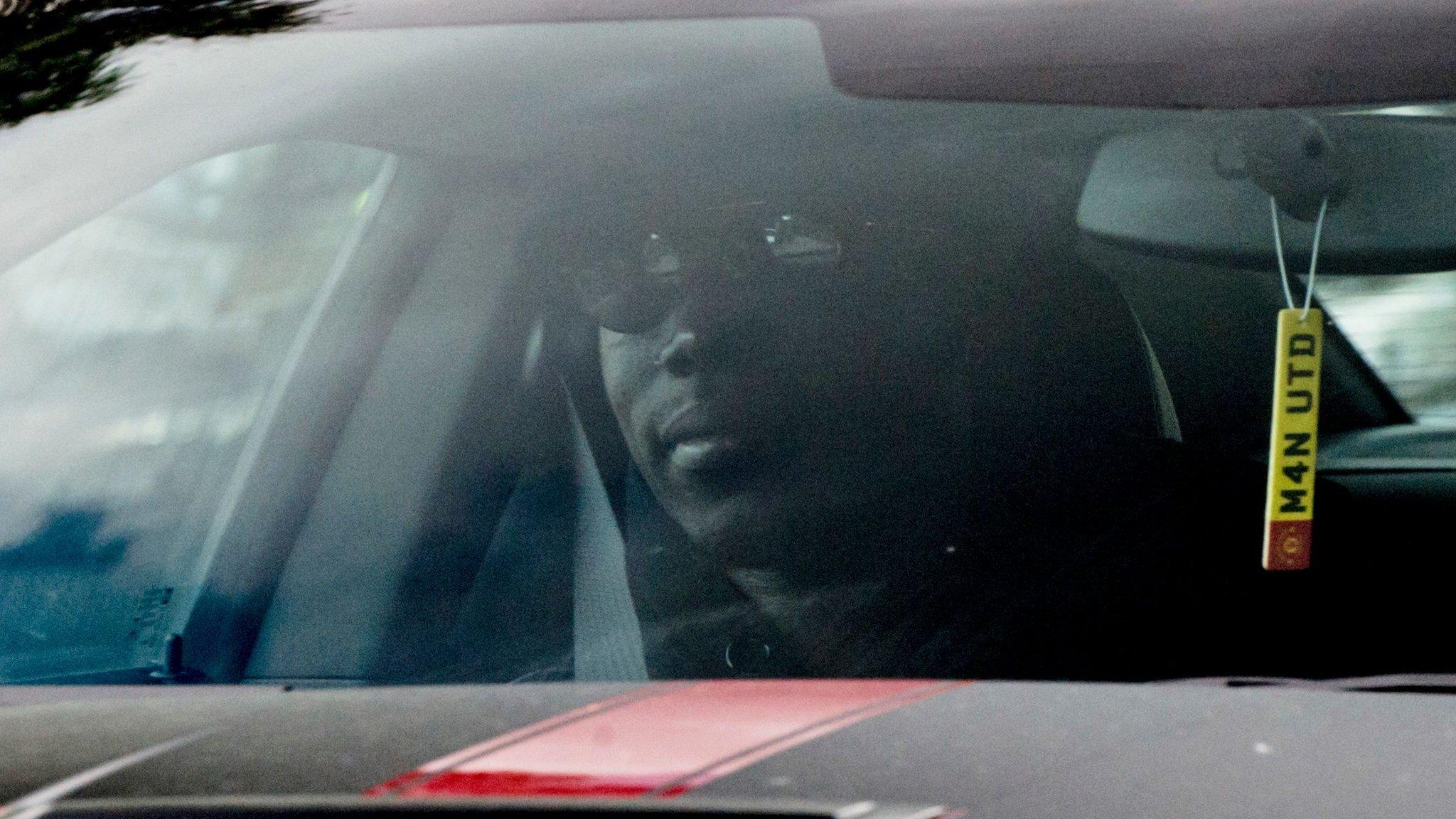 Paul Pogba arrives at Carrington