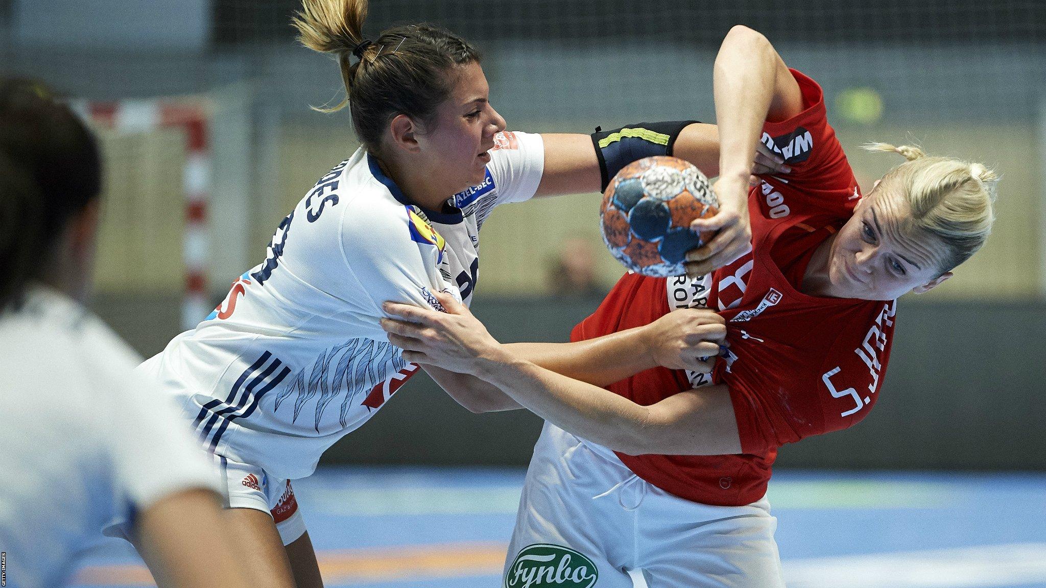 Viborg, Denmark, 27 September: Stine Jorgensen, right, of Denmark, challenges for the ball during the Golden League handball match between Denmark and France in Vibocold Arena. (Photo by Jan Christensen / FrontzoneSport via Getty Images)