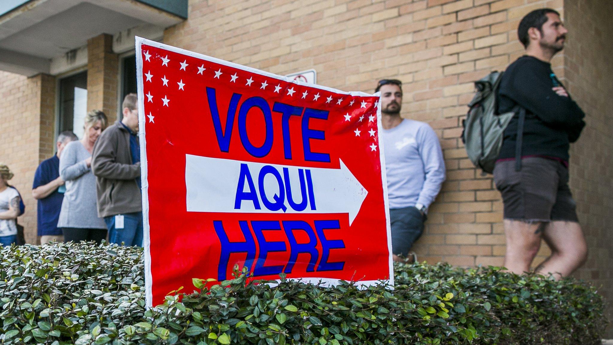 A line of voters wait in Austin, Texas, on 6 March 2018