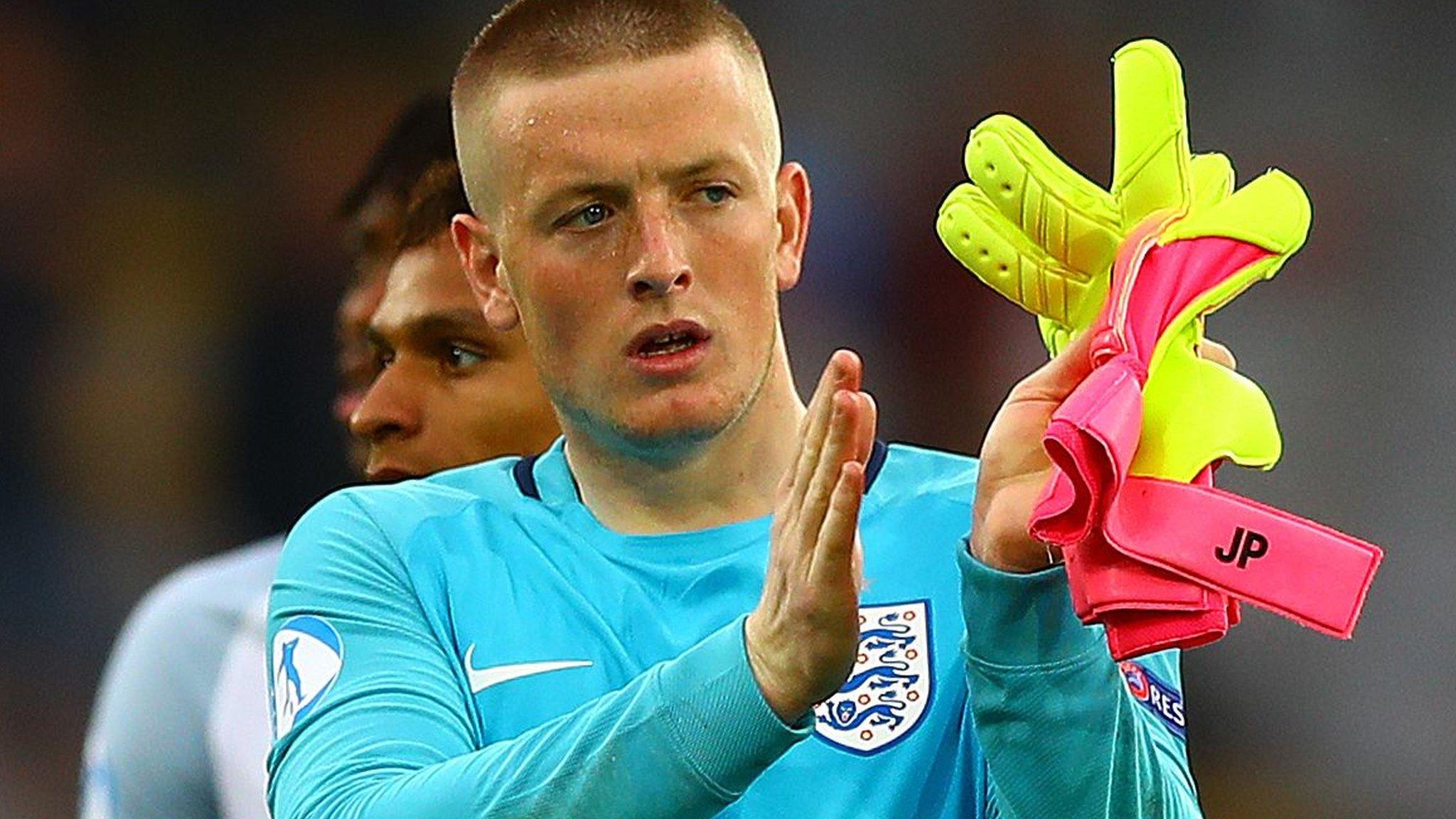 Jordan Pickford applauds the fans at full time