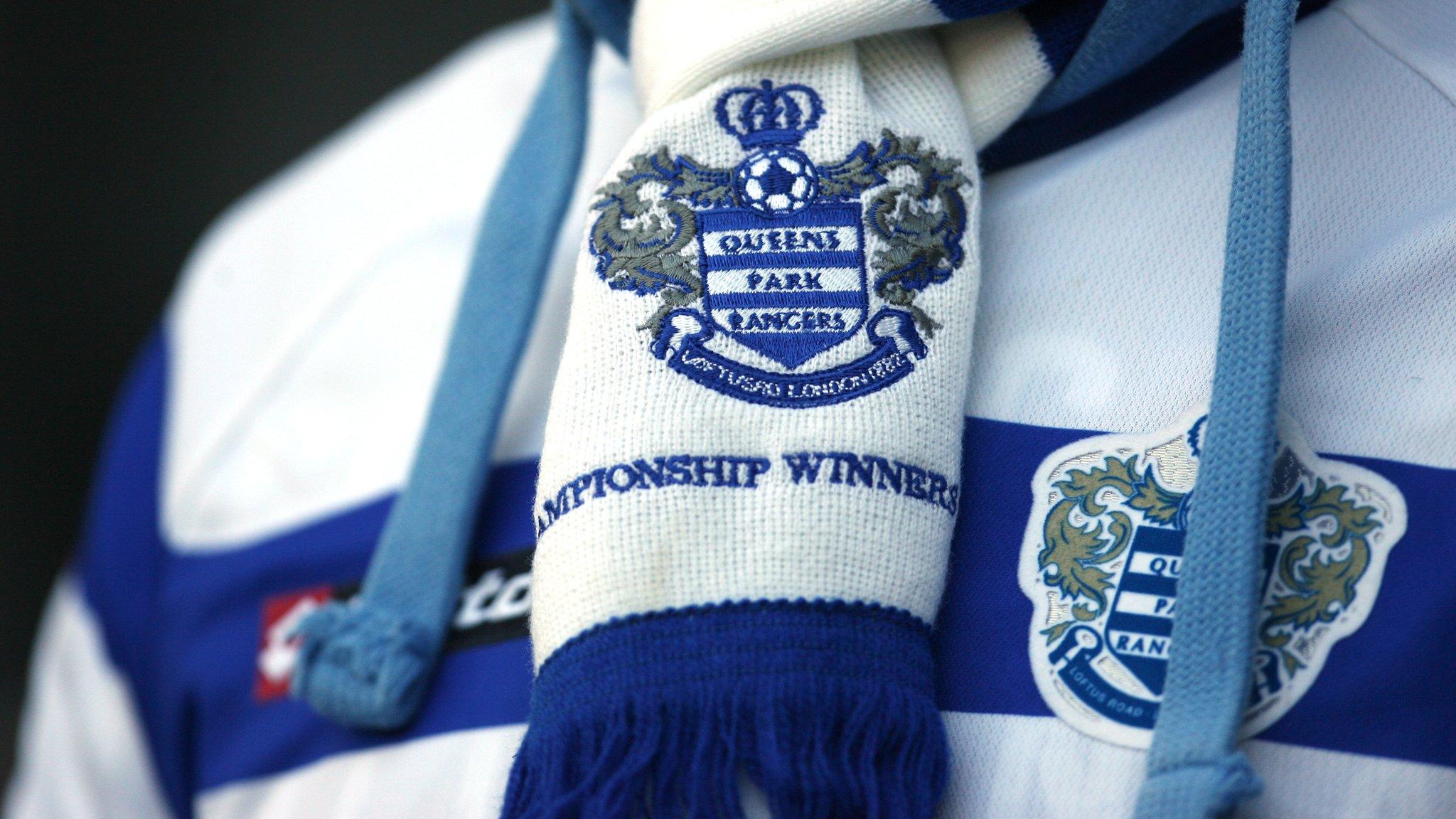 Fan wearing a QPR shirt with scarf