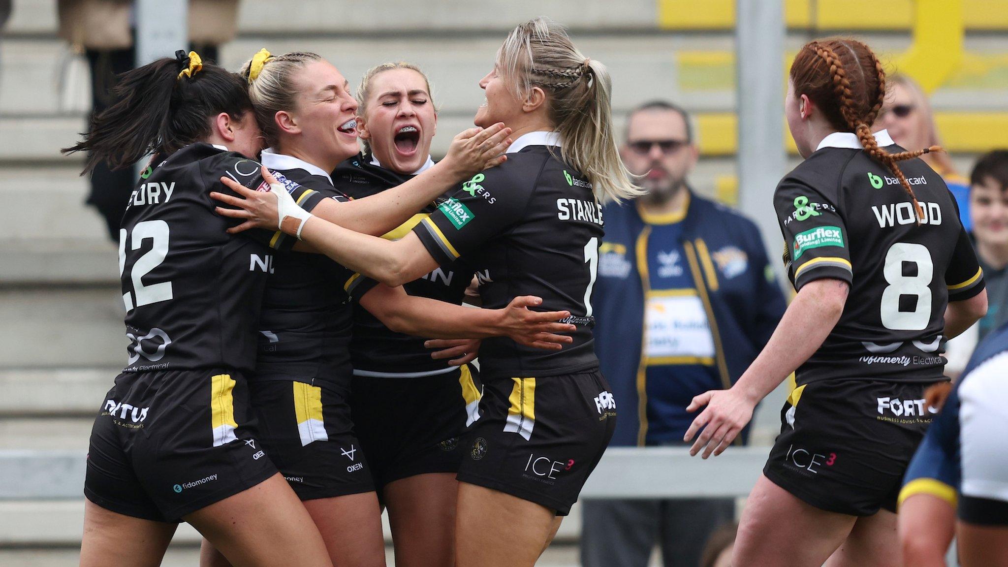 York Valkyrie players celebrate a try against Leeds Rhinos