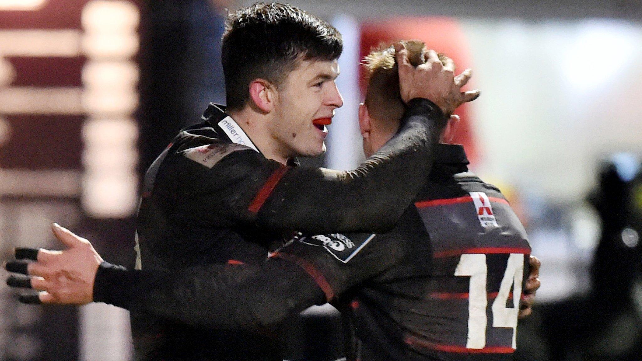 Blair Kinghorn and Dougie Fife embrace after the former's try