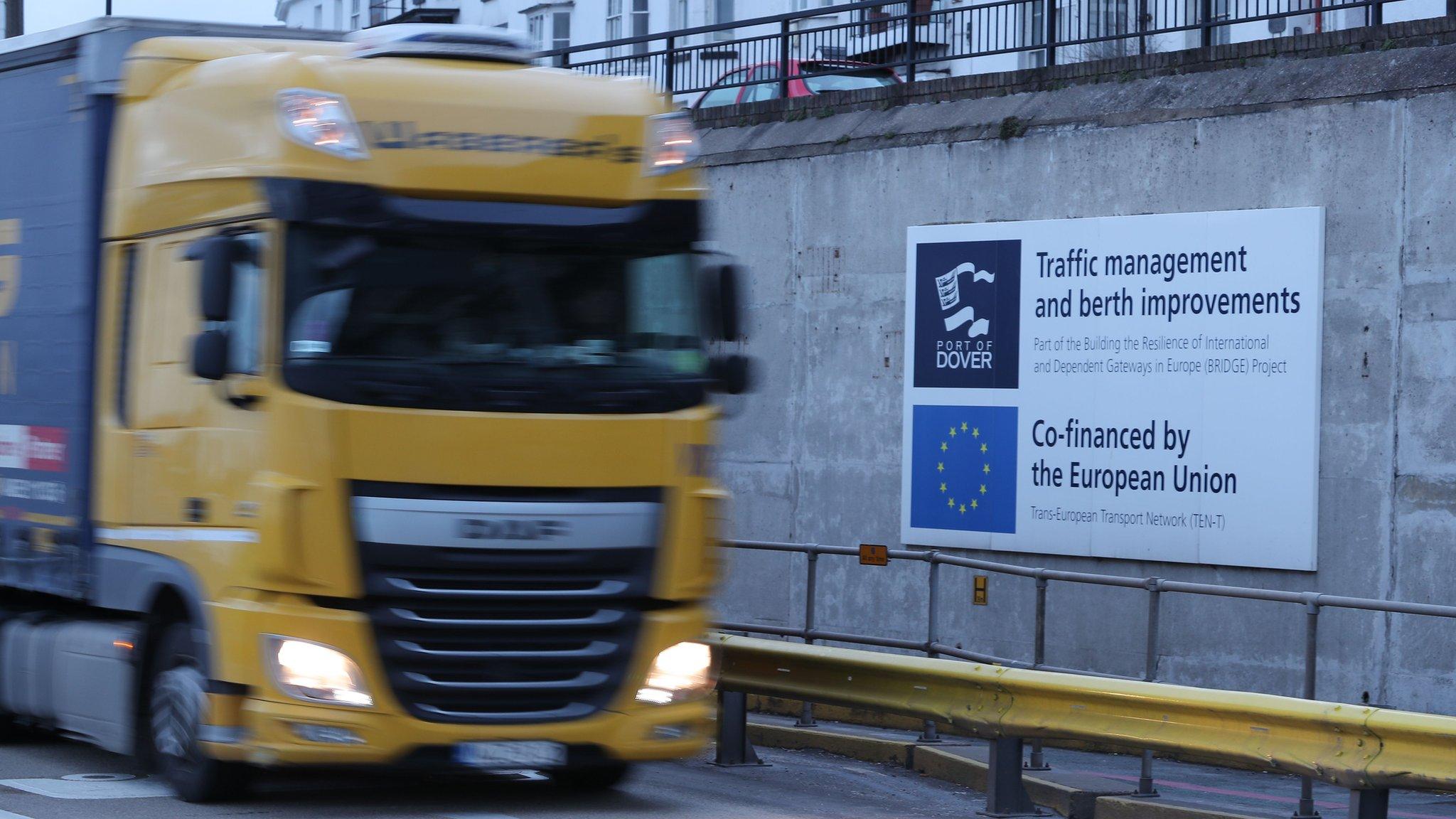 A lorry drives past an EU sign in Dover