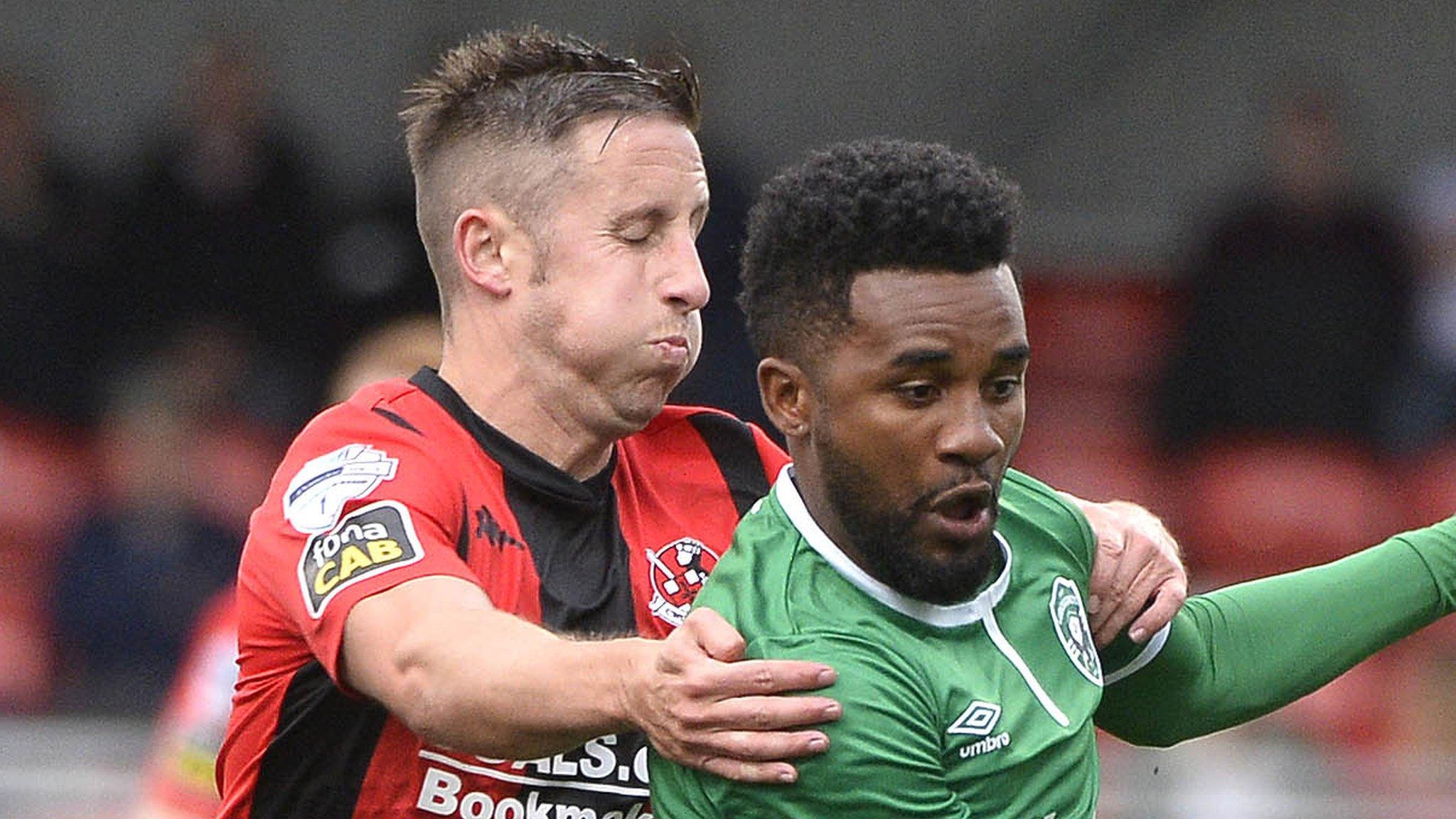 Crusaders striker Michael Carvill battles with Ludogorets midfielder Cicinho at Seaview