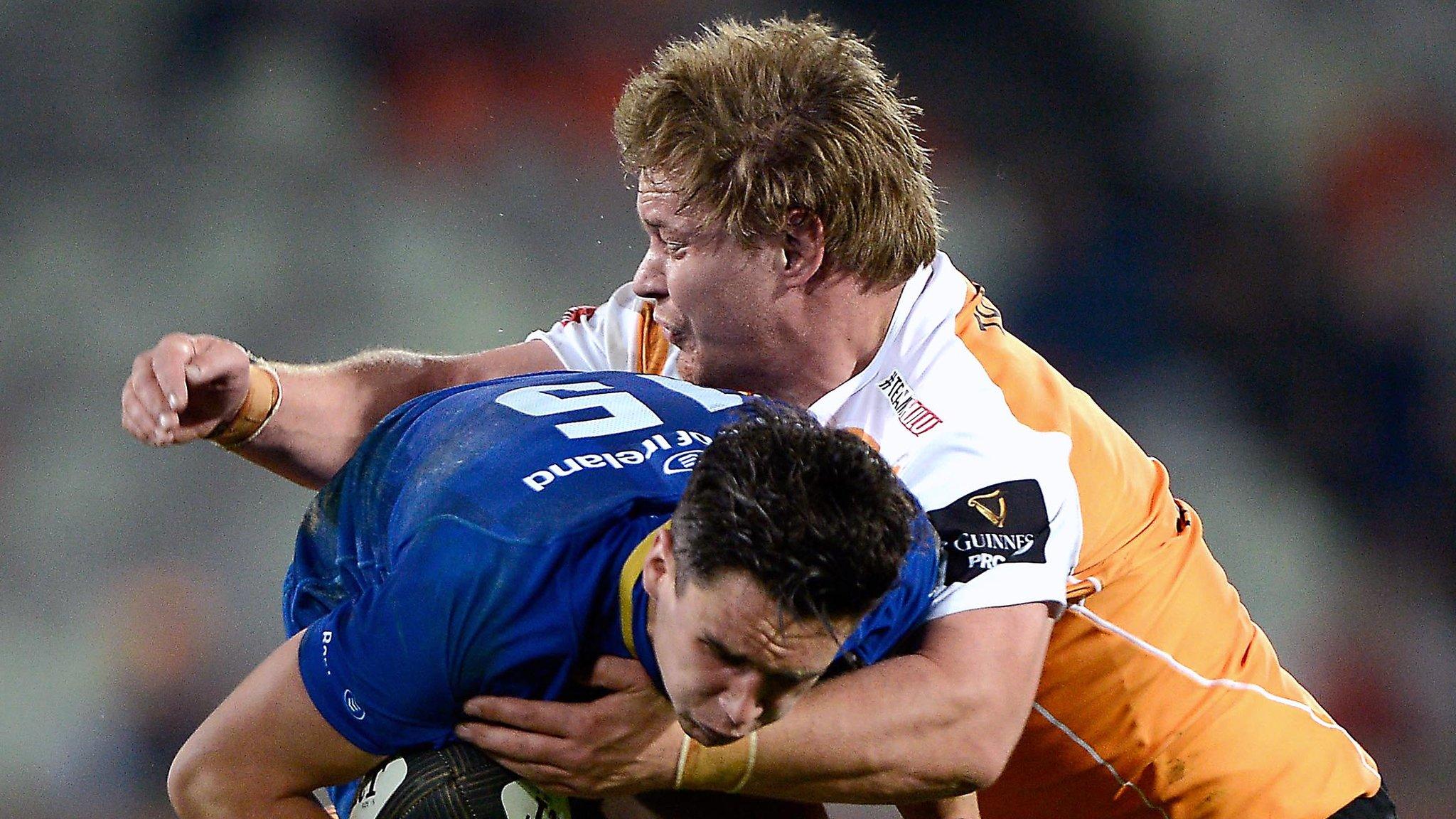 Cheetahs try-scorer Torsten van Jaarsfeld tackles Leinster full-back Joey Carbery