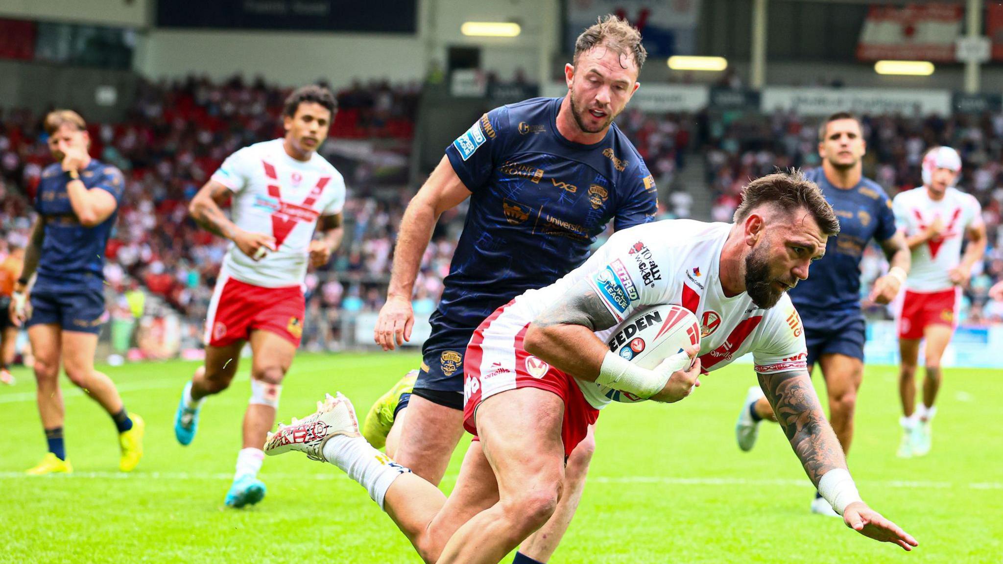 St Helens' Kyle Feldt scores against Salford Red Devils