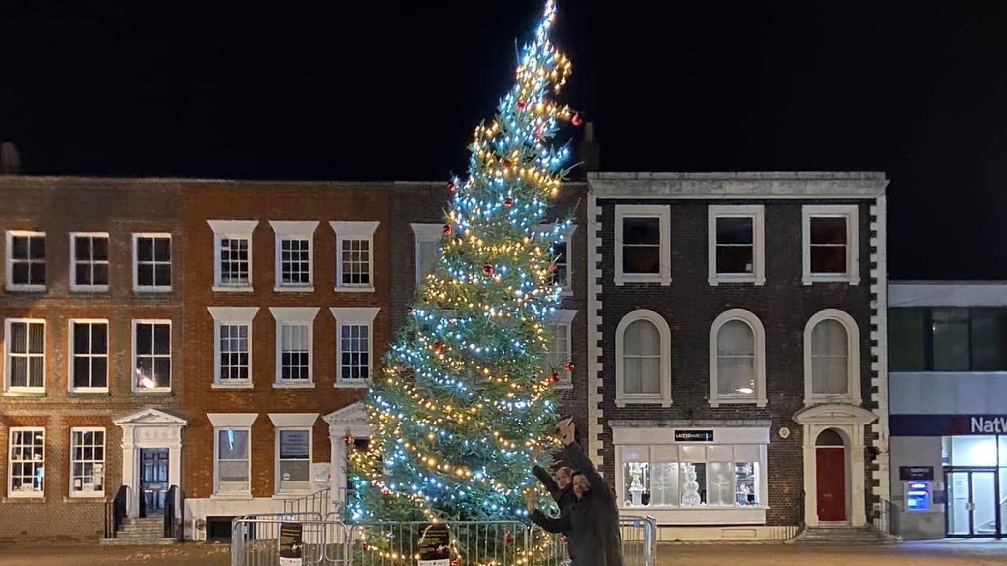 Neil Elshaw (front) and Brian Parsons with wonky Christmas tree