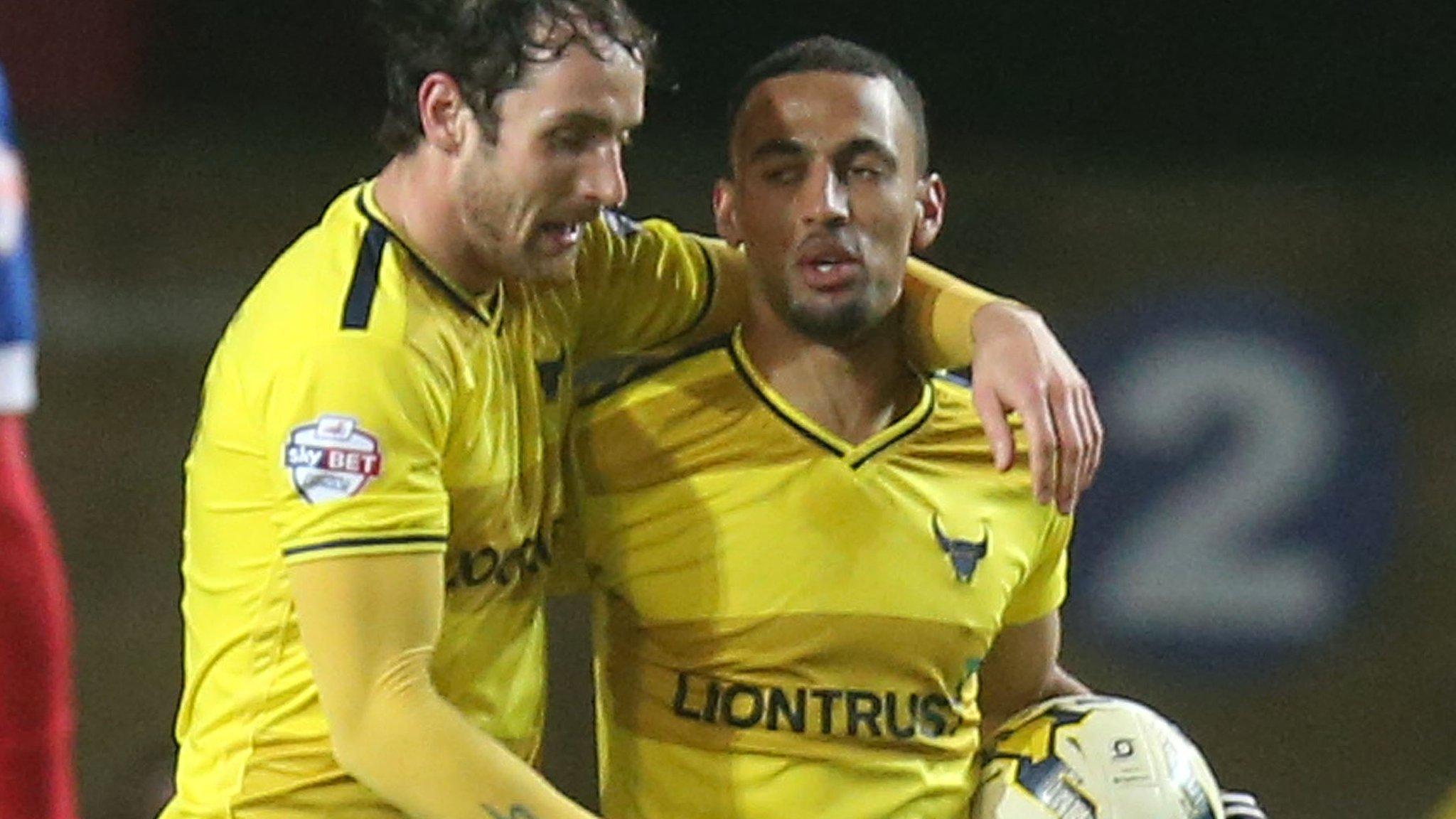 Oxford United celebrate Kemar Roofe's hat-trick against Dagenham