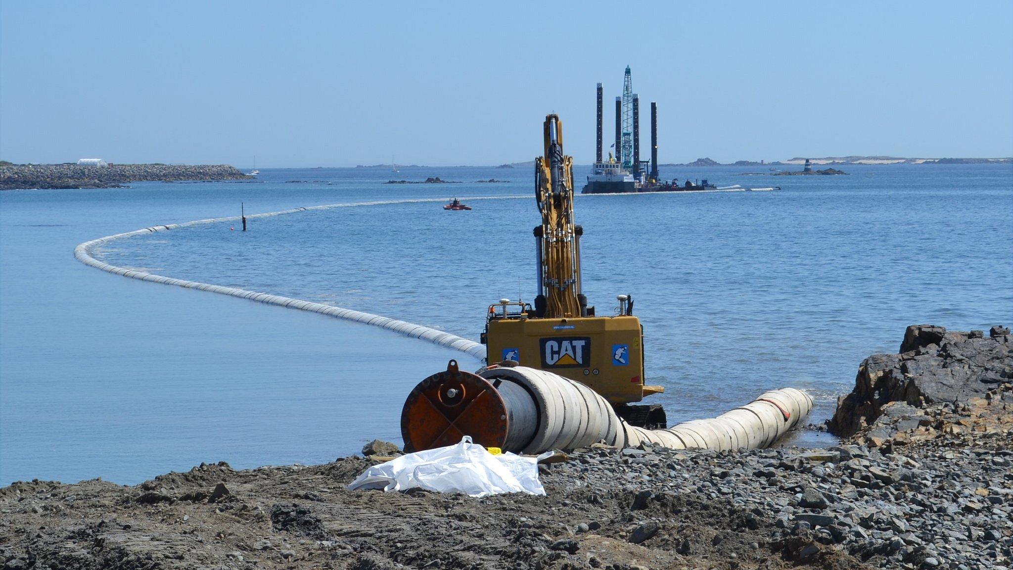 Sewage outfall pipe being laid in Belle Greve Bay, Guernsey