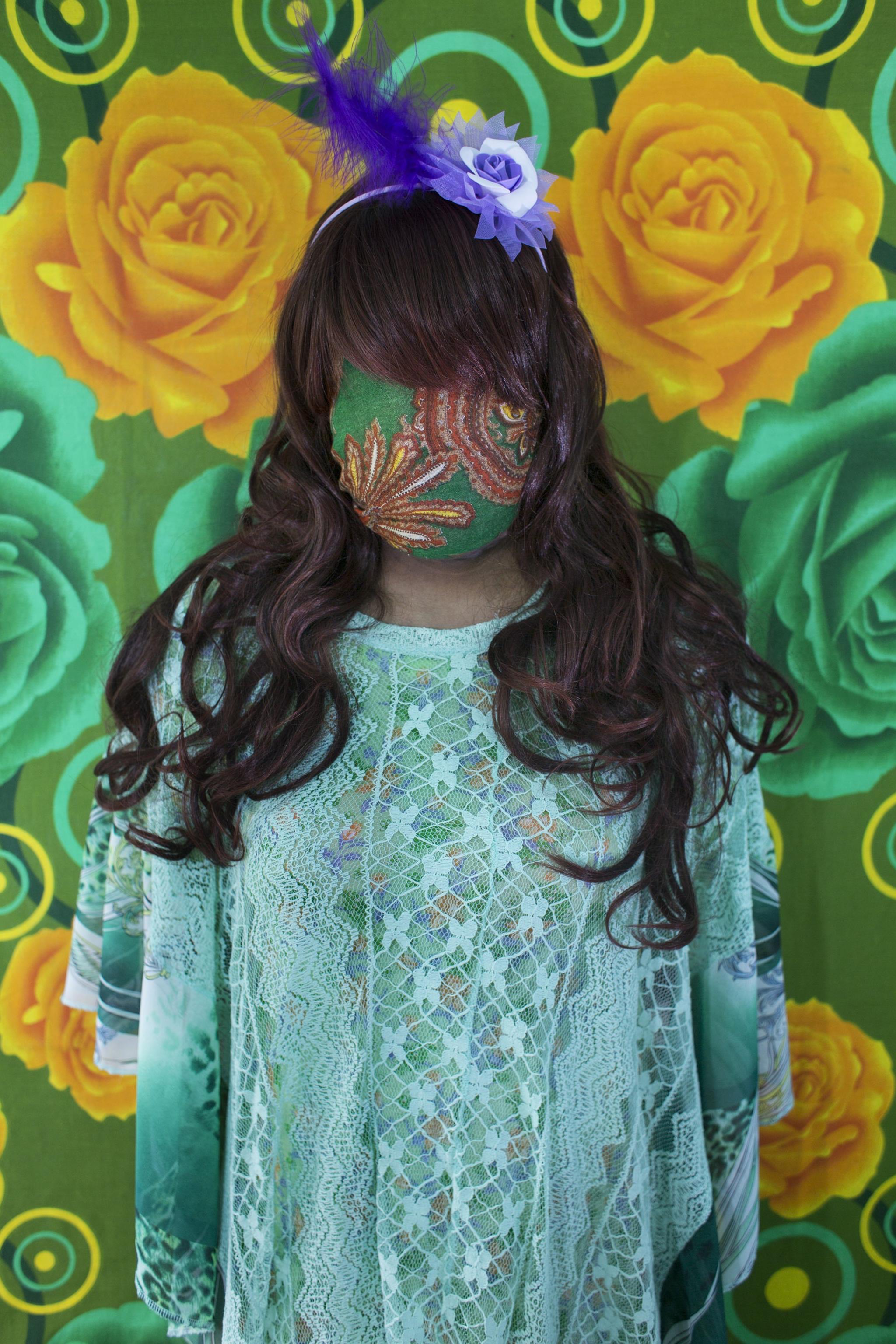 Bangladeshi woman with face covered by green fabric