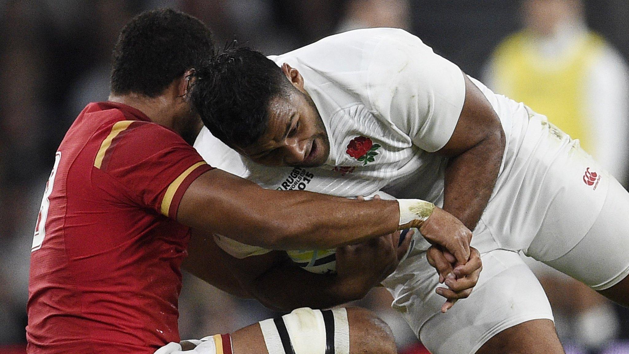 Taulupe Faletau tackles his cousin Billy Vunipola