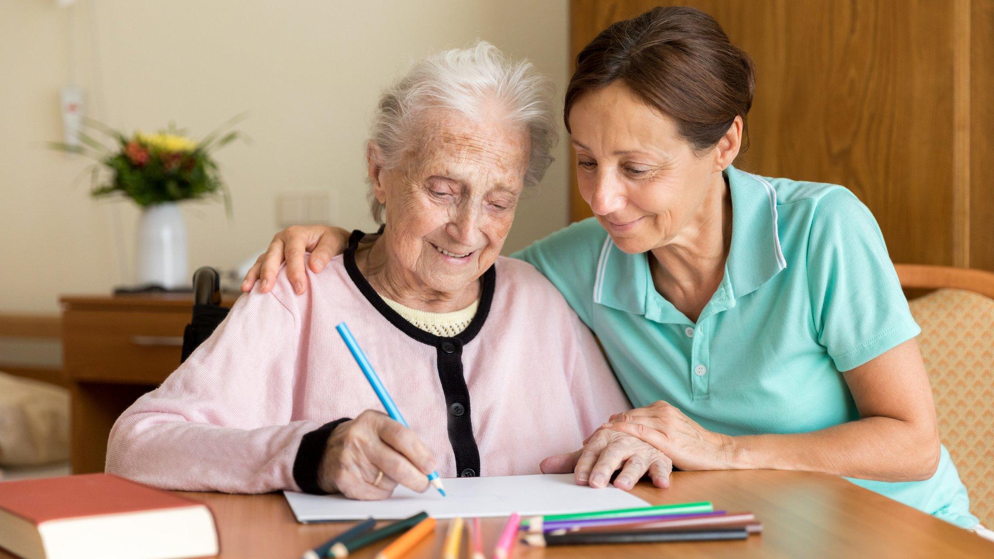 A carer with an elderly person