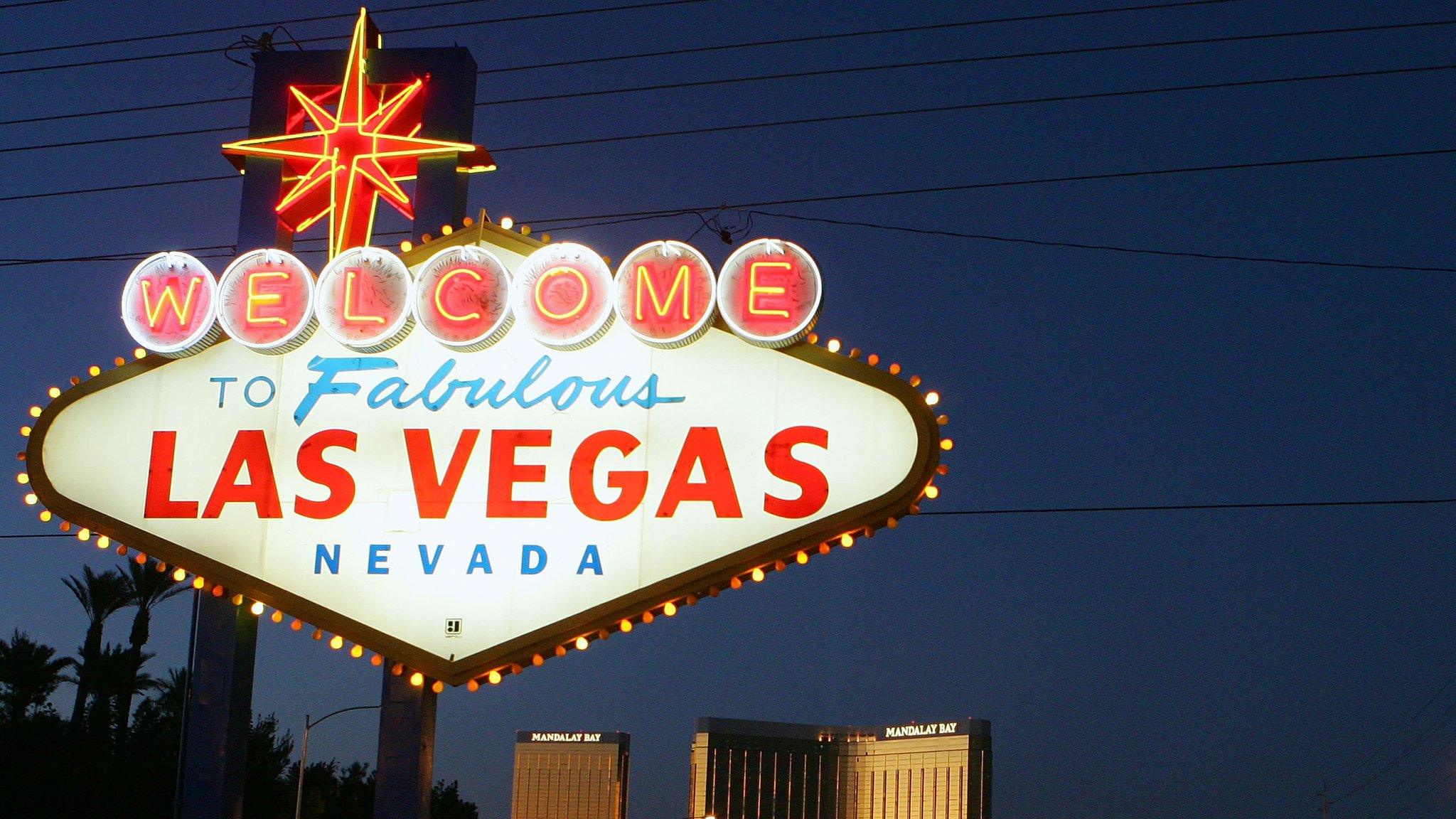 Traffic passes by the famous sign welcoming motorists on the south end of the Las Vegas Strip November 11, 2005 in Las Vegas, Nevada. The Mandalay Bay Resort & Casino is in the background.