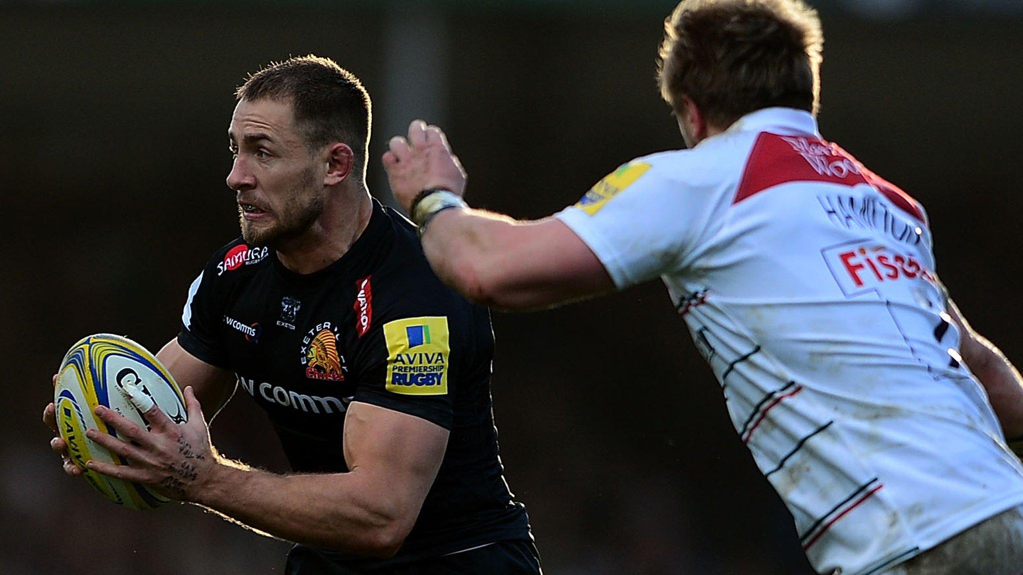 Sam Hill of Exeter Chiefs looks to break past Luke Hamilton of Leicester Tigers