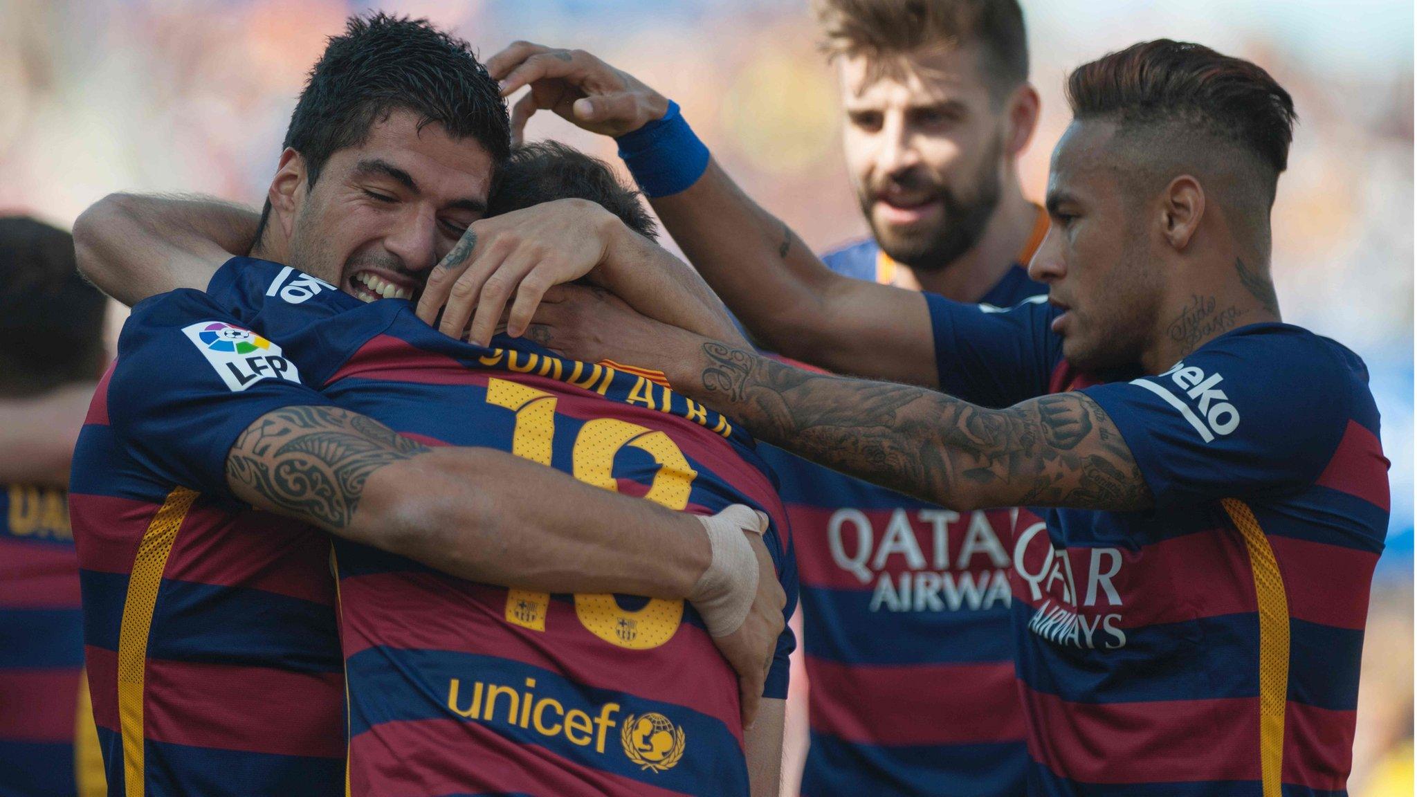 Barcelona players celebrate a Luis Suarez goal against Granada