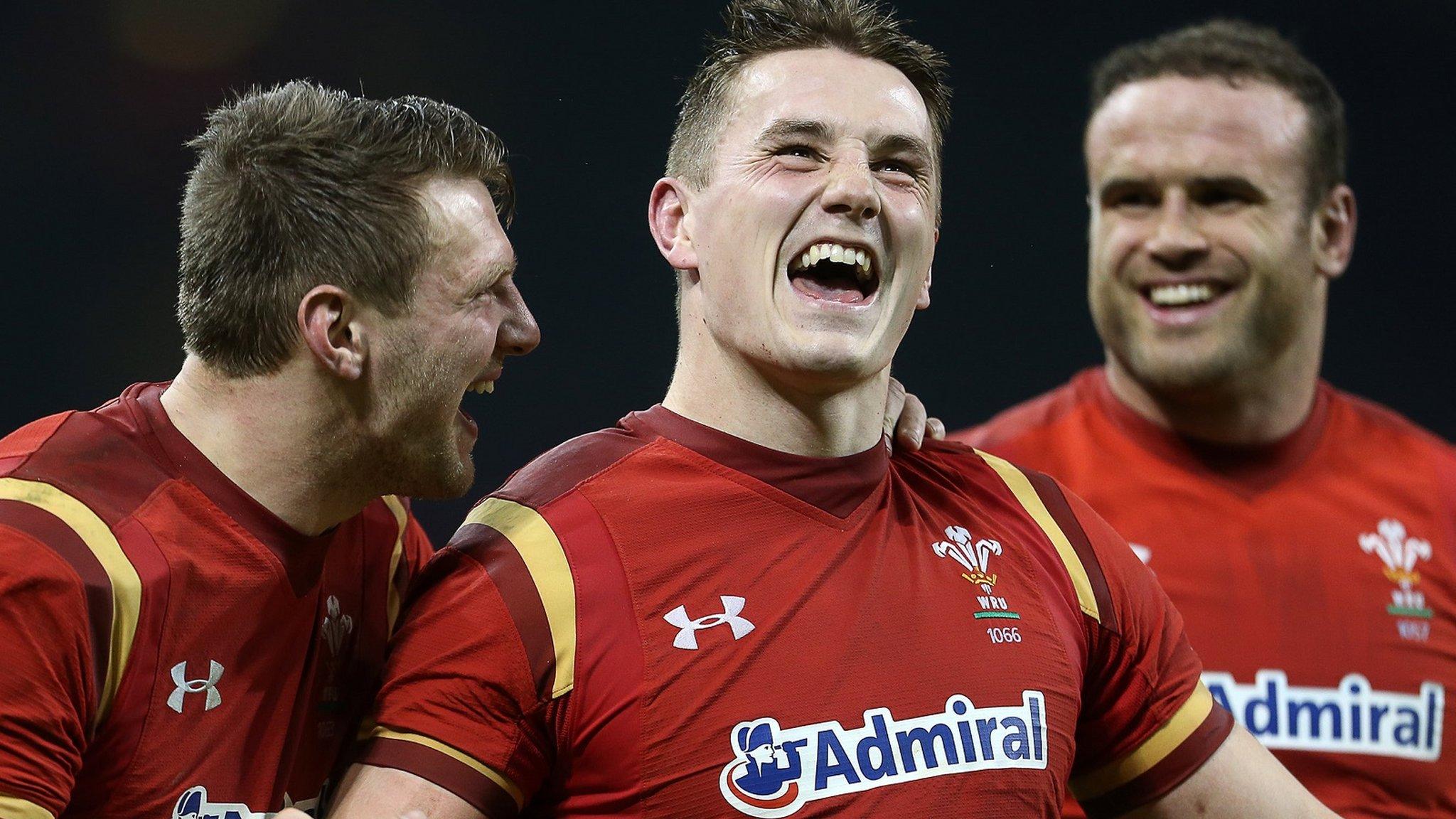 Dan Biggar, Jonathan Davies and Jamie Roberts celebrate victory over Ireland