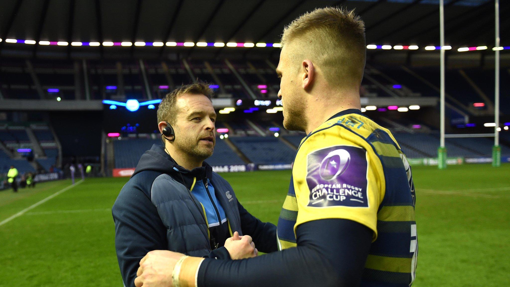 Danny Wilson celebrates with Gareth Anscombe