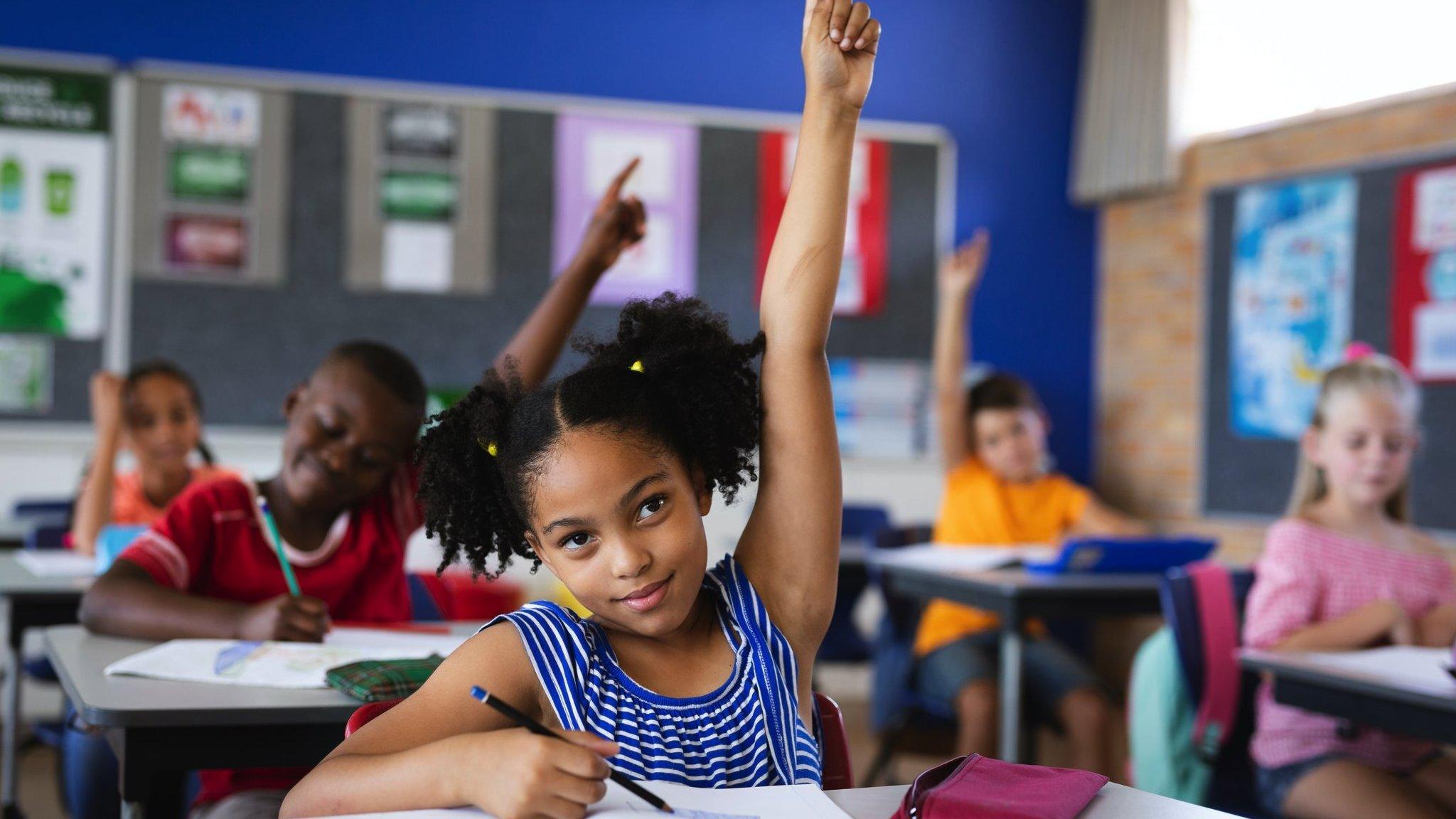 Child with her hand up