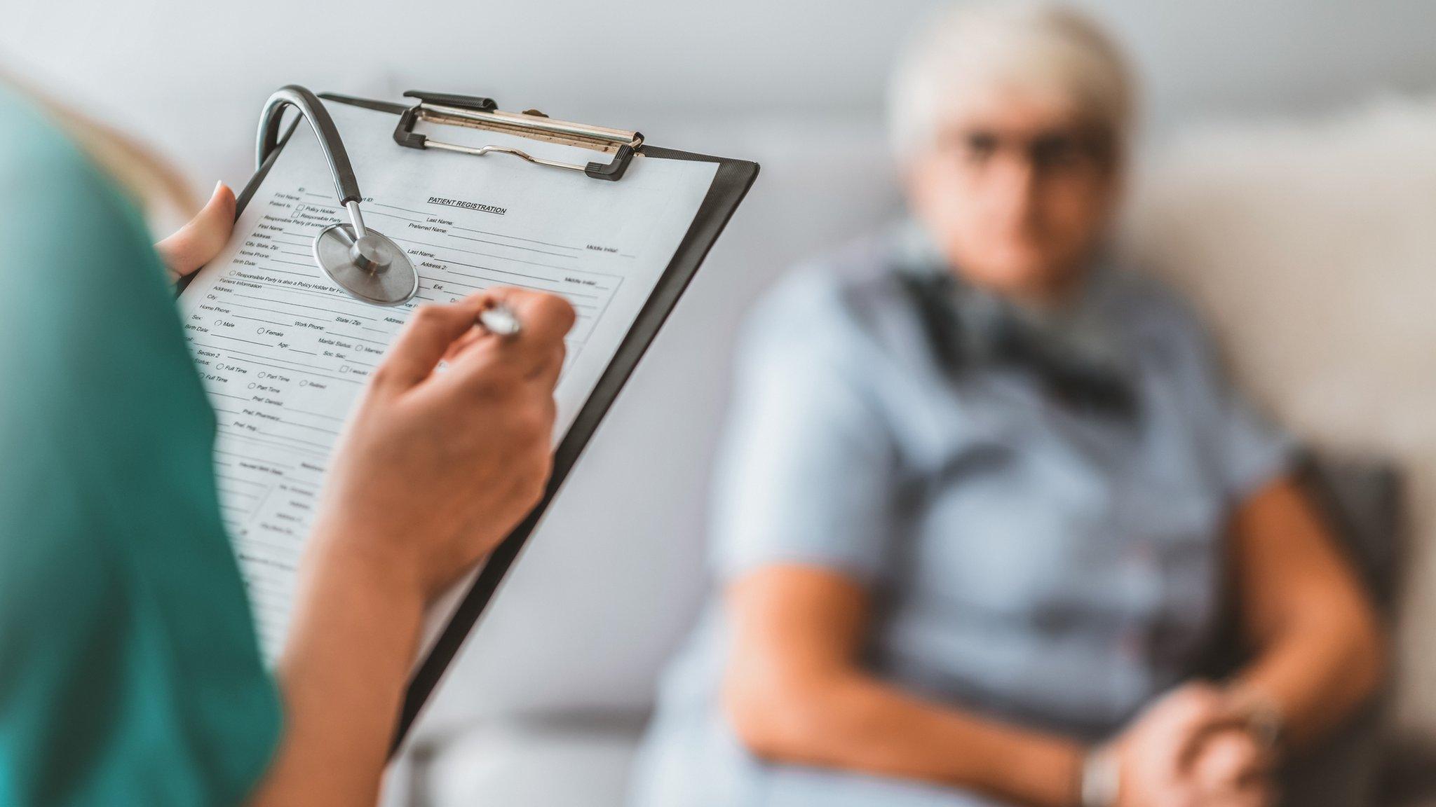 Woman being assessed by doctor