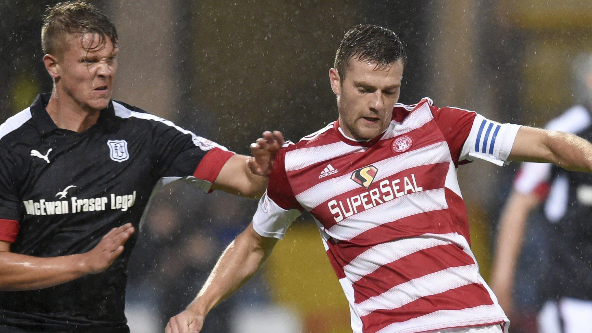 Dundee's Mark O'Hara (left) challenges Hamilton's Michael Devlin