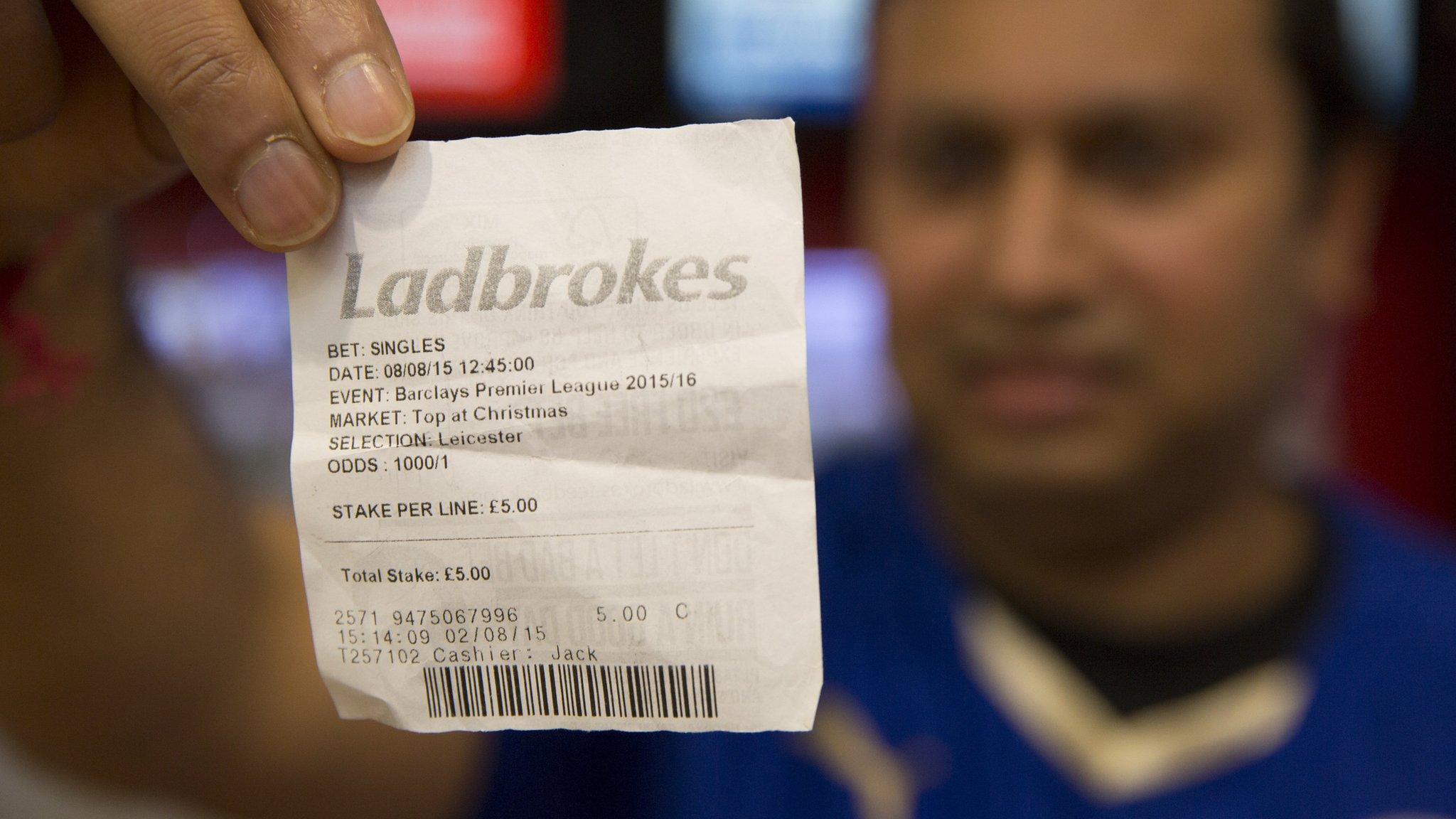 Leicester fan with betting slip