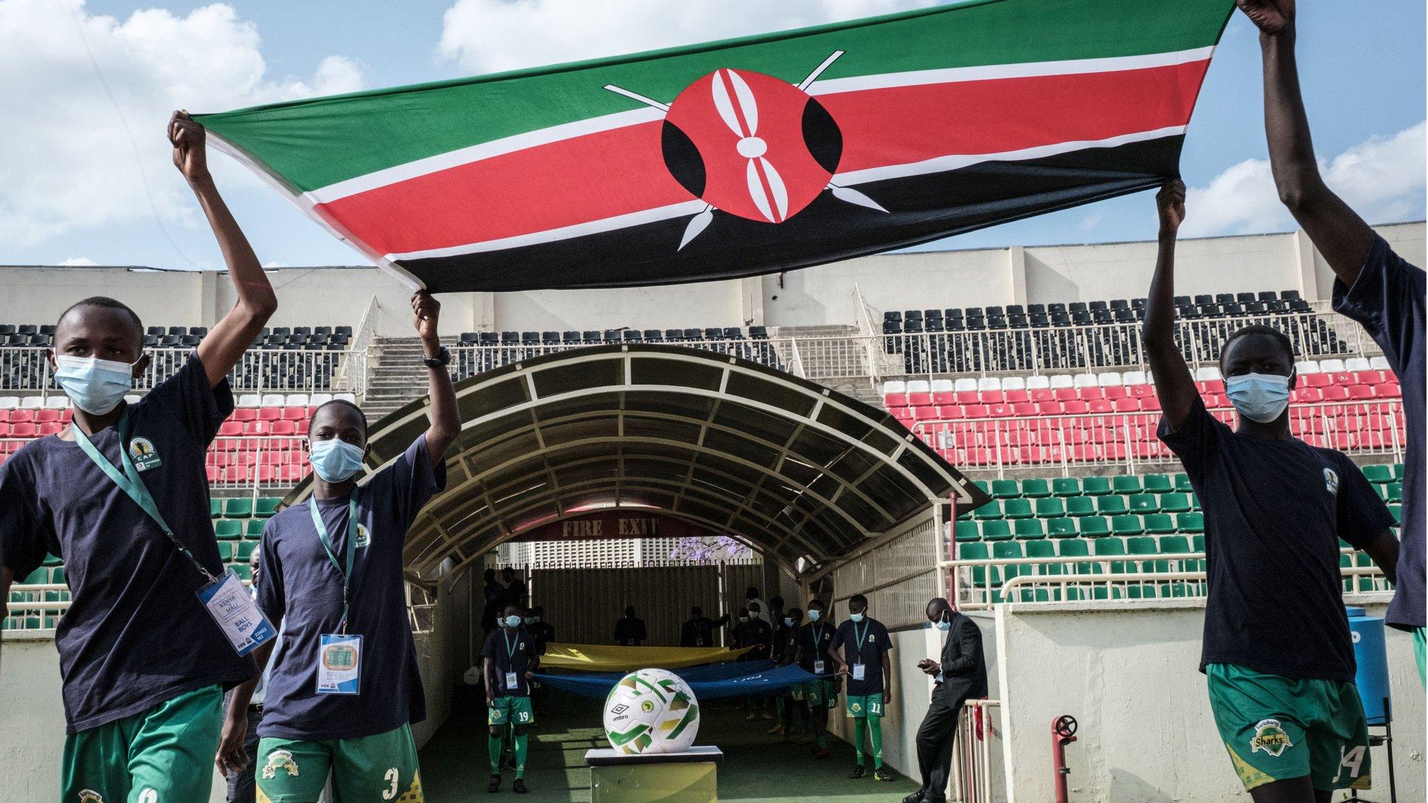 Mascots lead out a Kenyan flag before an international match