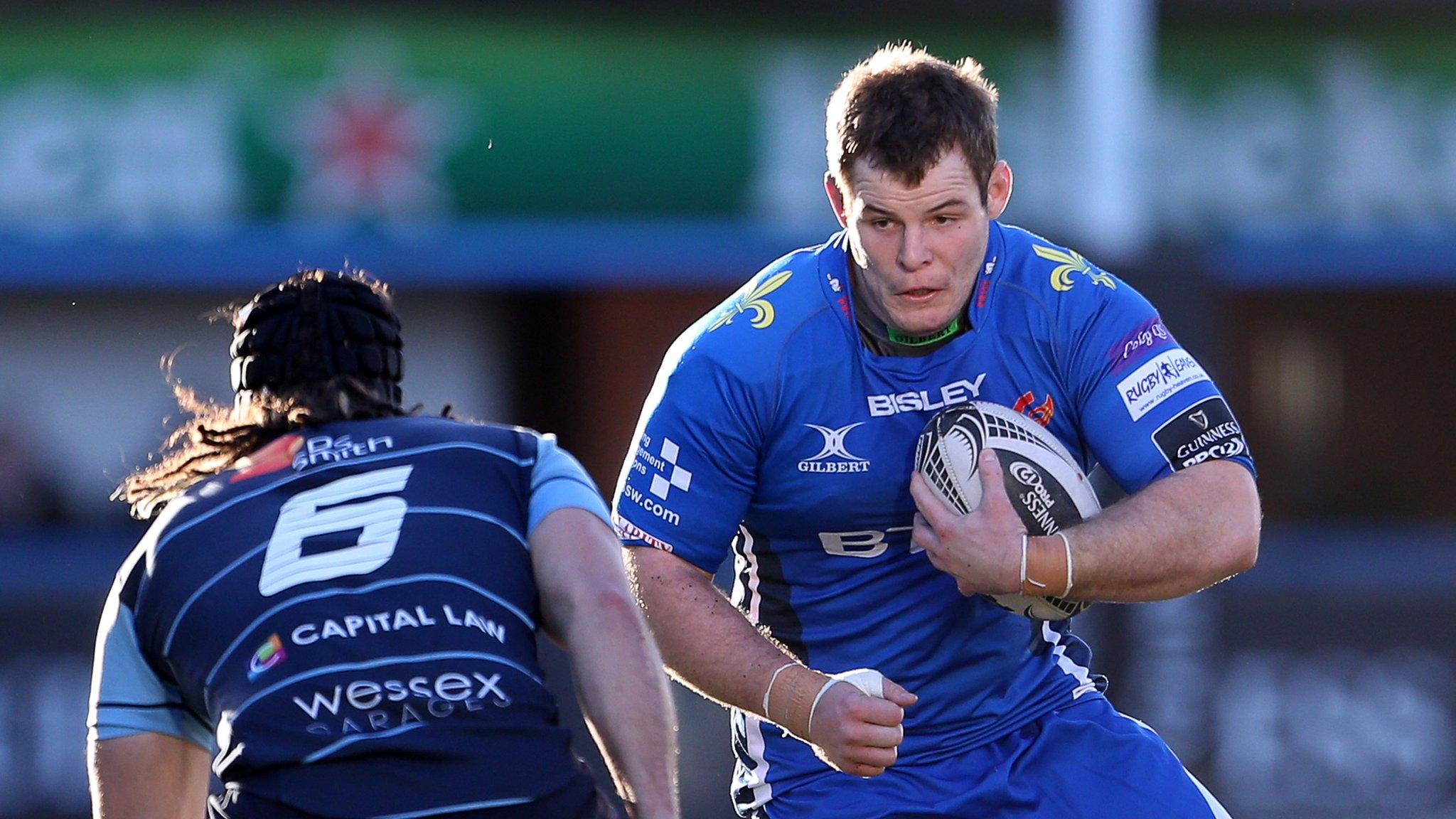 Sam Hobbs of Newport Gwent Dragons takes on Cardiff Blues flanker Josh Navidi