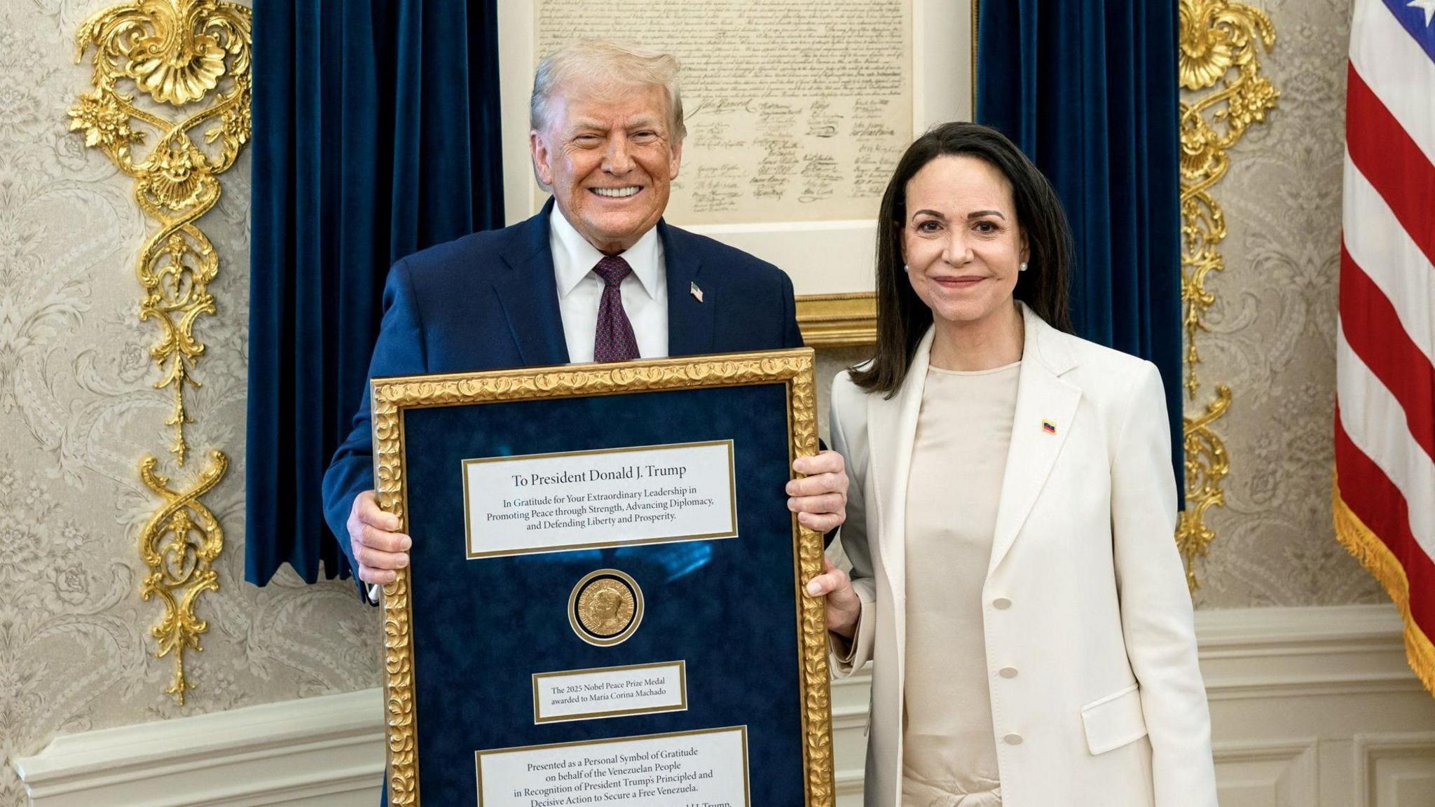 Venezuelan opposition leader Maria Corina Machado presenting President Trump with her Nobel Peace Prize.