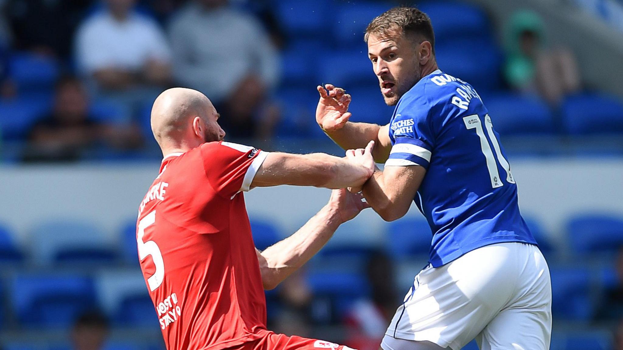 Matt Clarke (left) of Middlesbrough challenges Aaron Ramsey of Cardiff