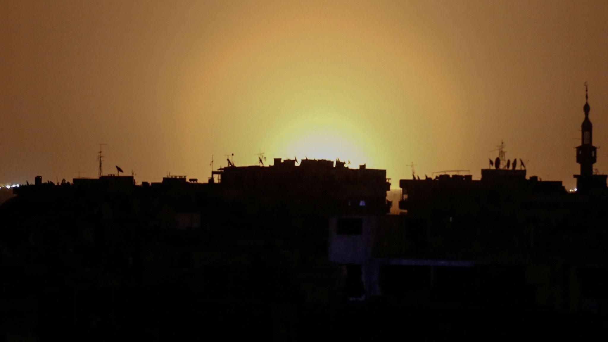 A photo taken from the rebel-held suburb of Douma shows what appears to be a blaze at Damascus International Airport (27 April 2017)