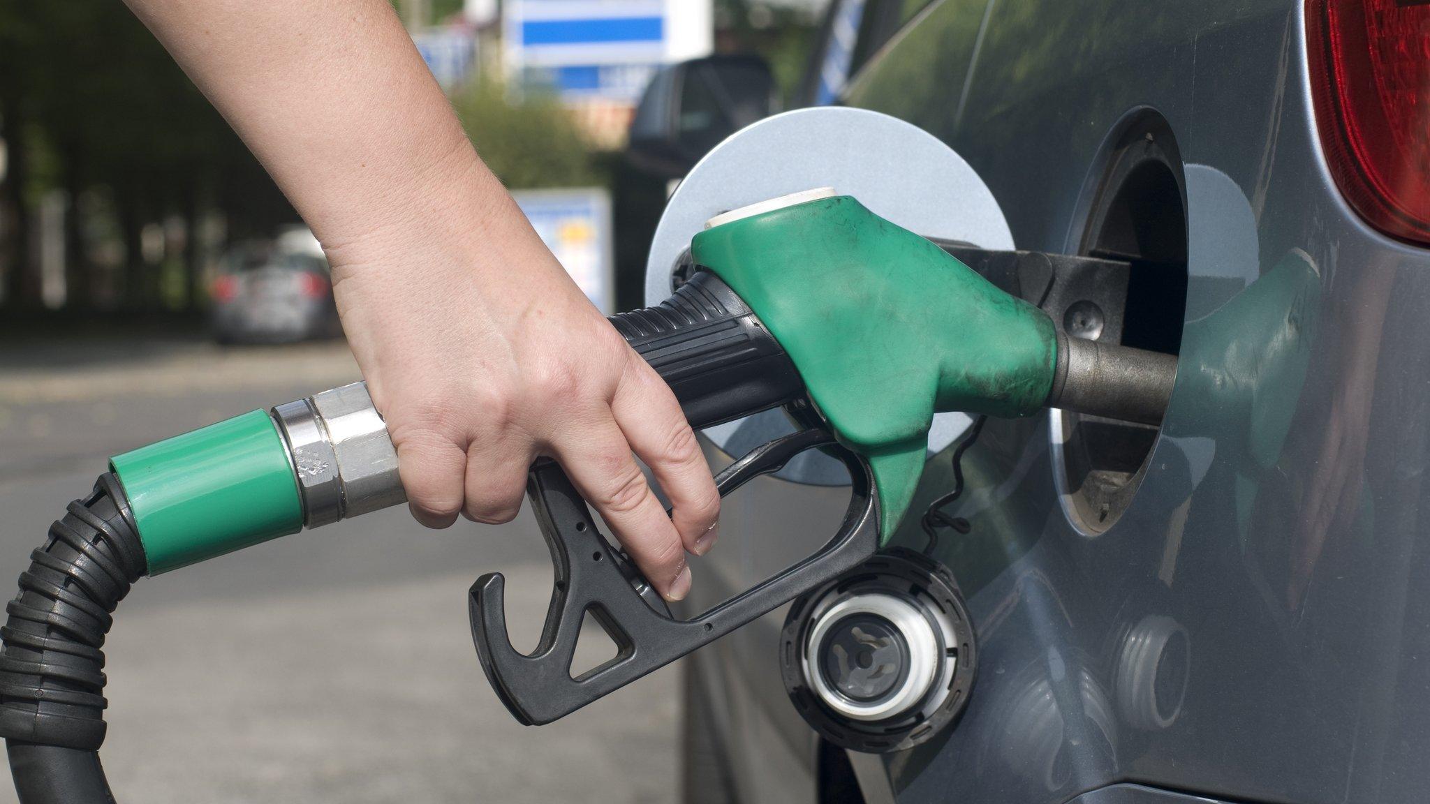 Person using petrol pump