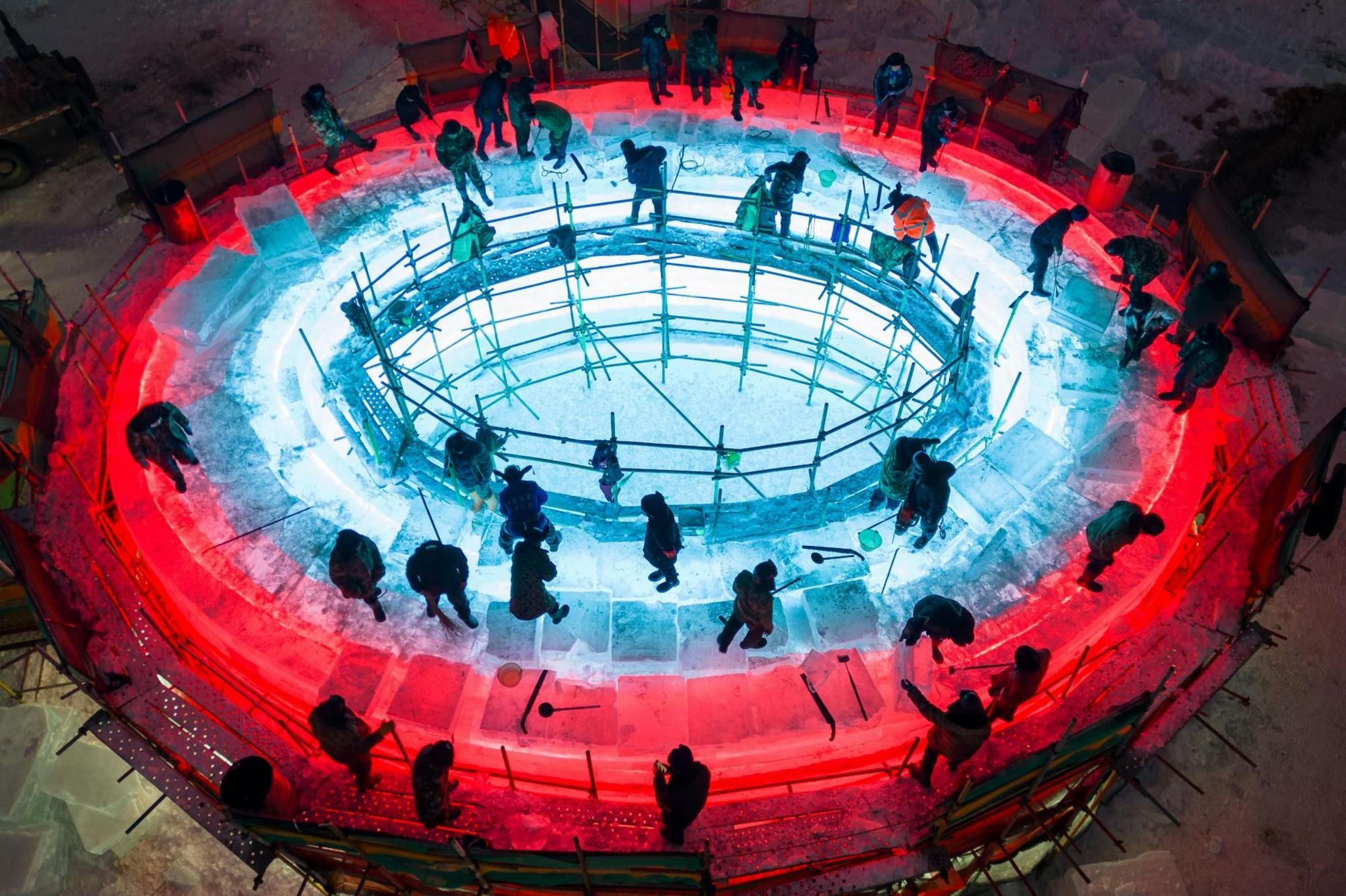 Workers construct a circular sculpture in Harbin, China 