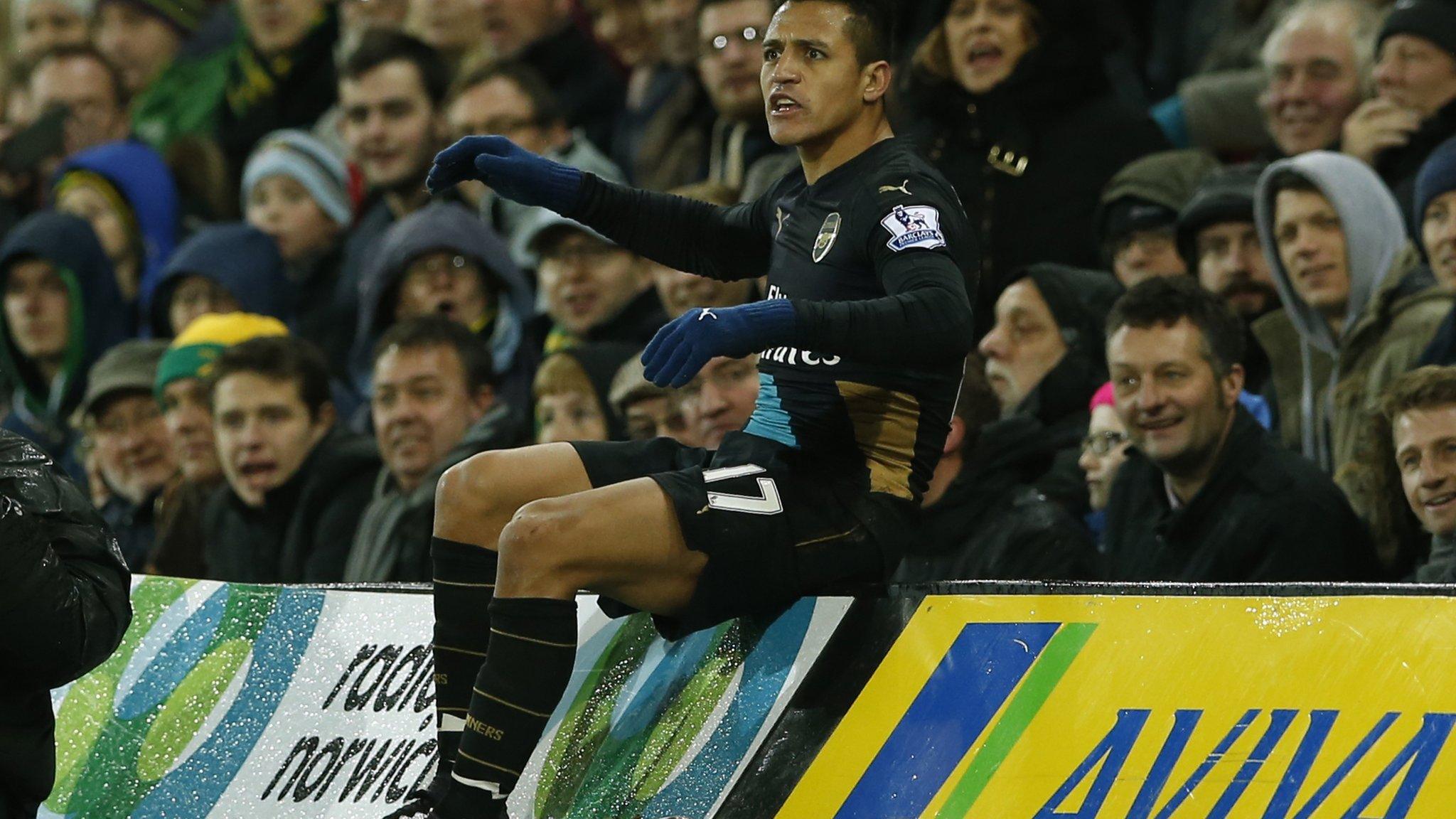 Alexis Sanchez after his tumble into the camera pit at Norwich