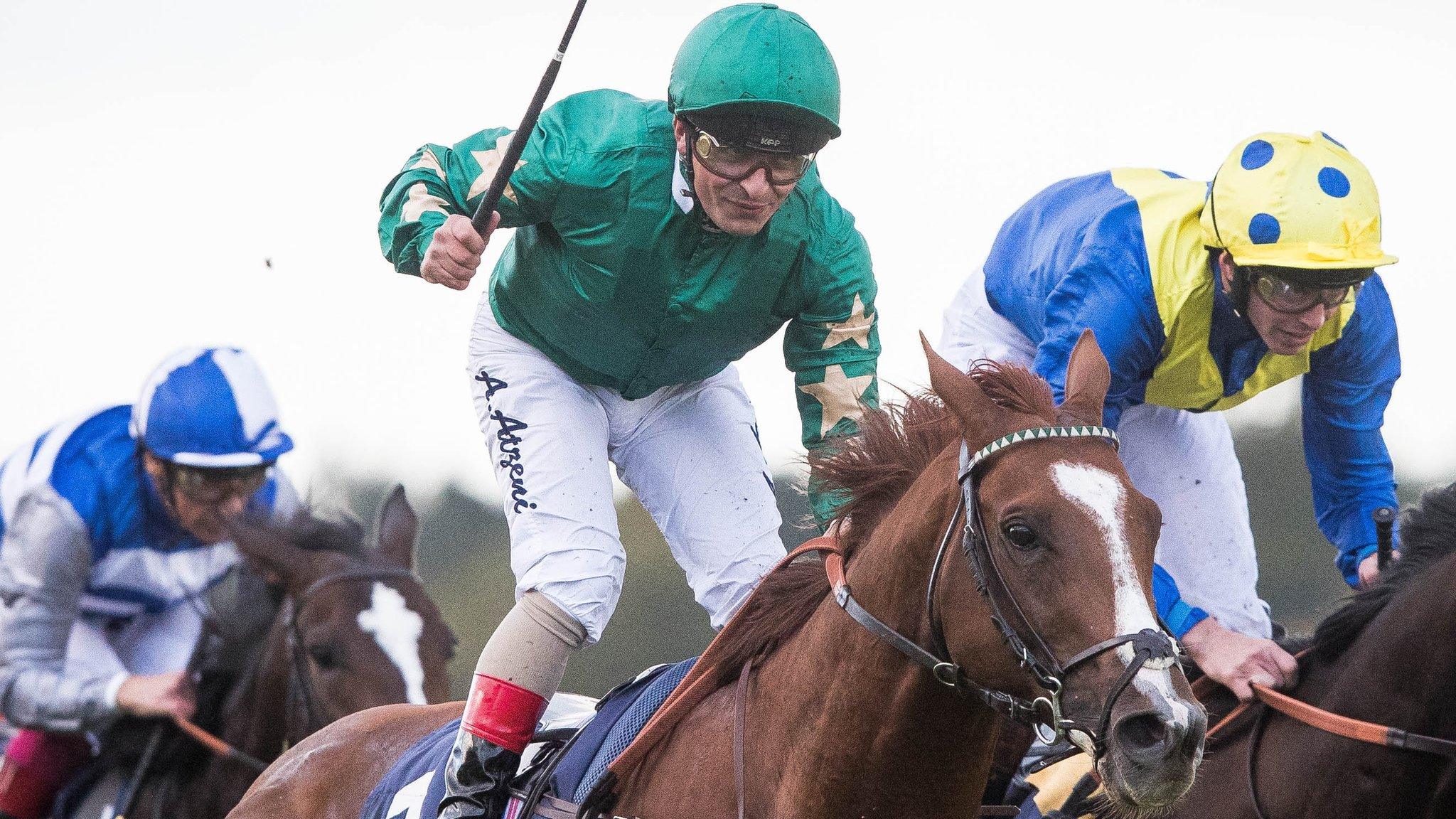 Andrea Atzeni shows his delight after guiding Decorated Knight to victory in the Irish Champion Stakes