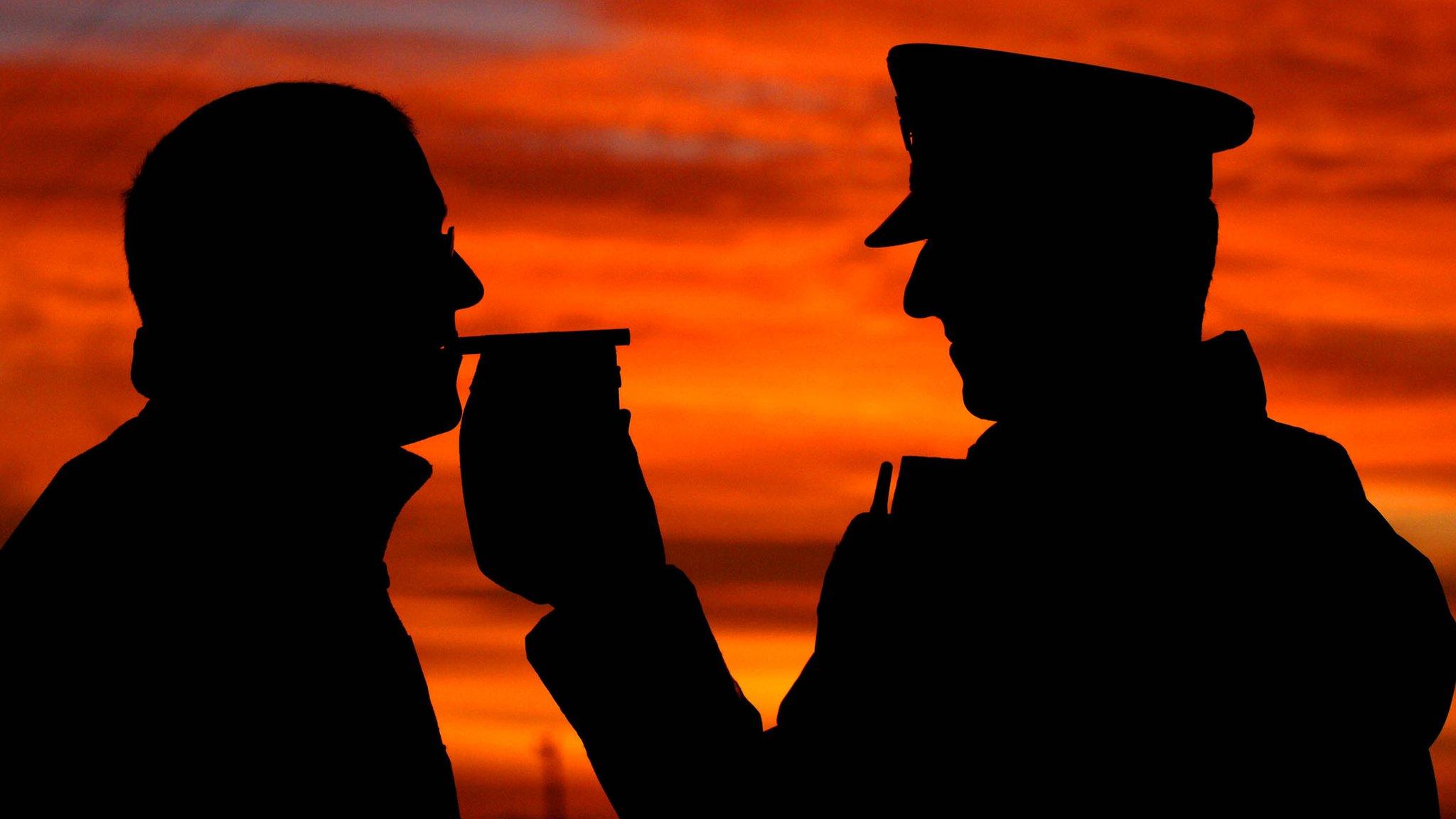 Police officer carrying out a breath test