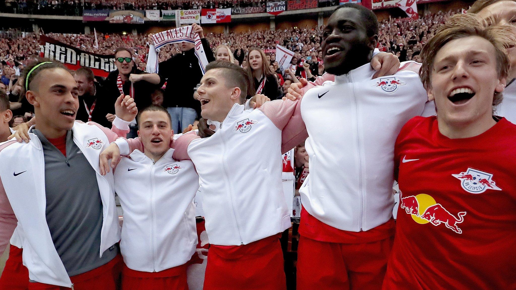 RB Leipzig players celebrate after securing a place in next season's Champions League