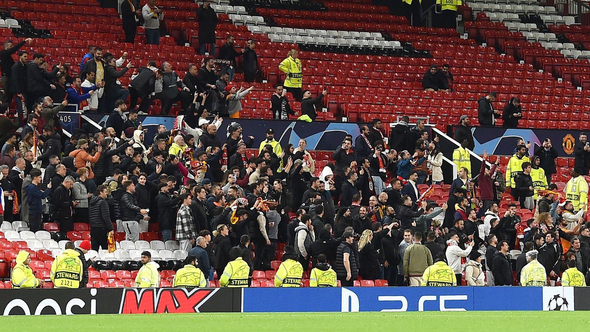 Galatasaray fans celebrate as their side beat Manchester United