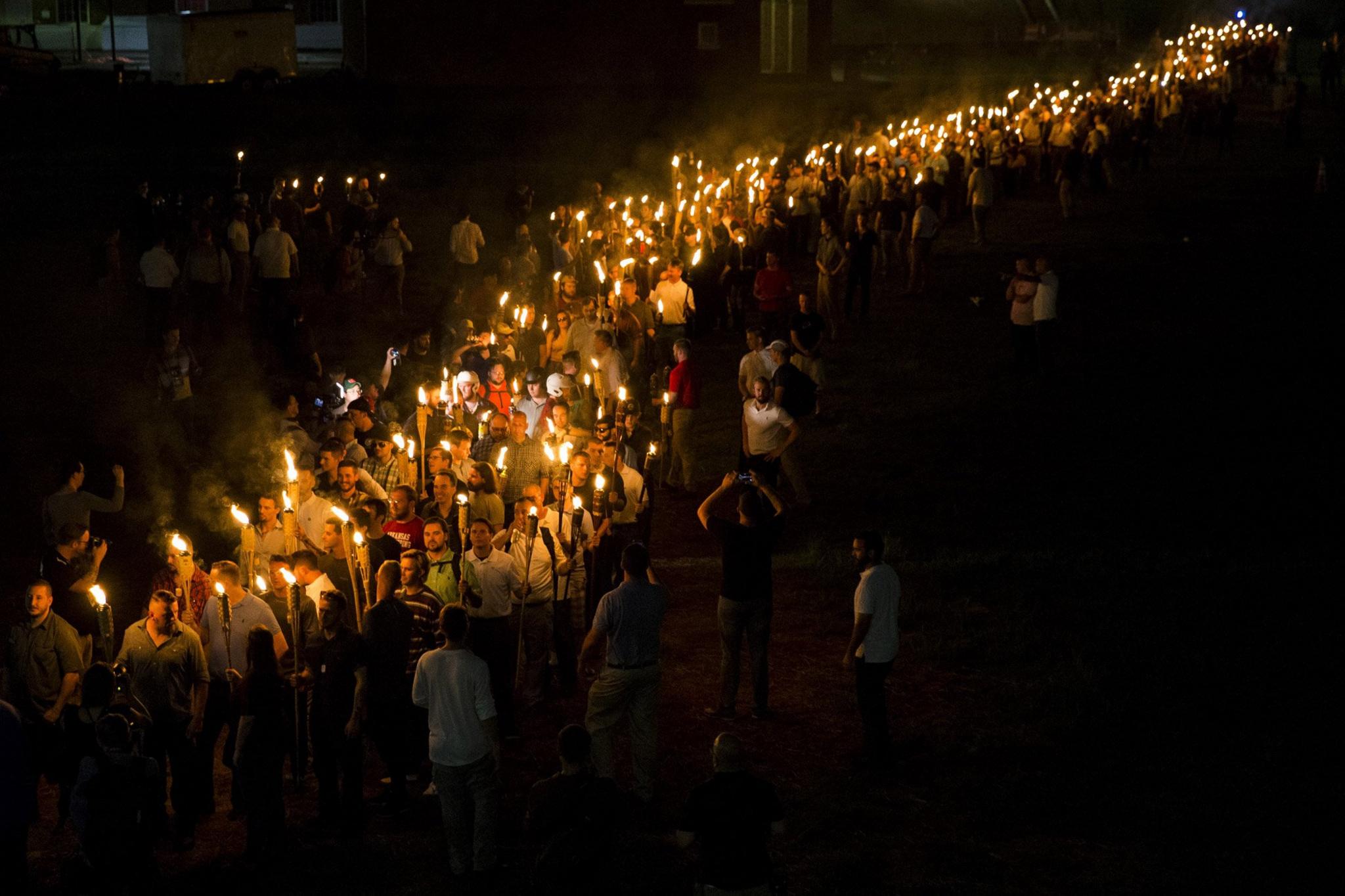 White nationalists march through the University of Virginia Campus with torches in Charlottesville, USA. August 2017