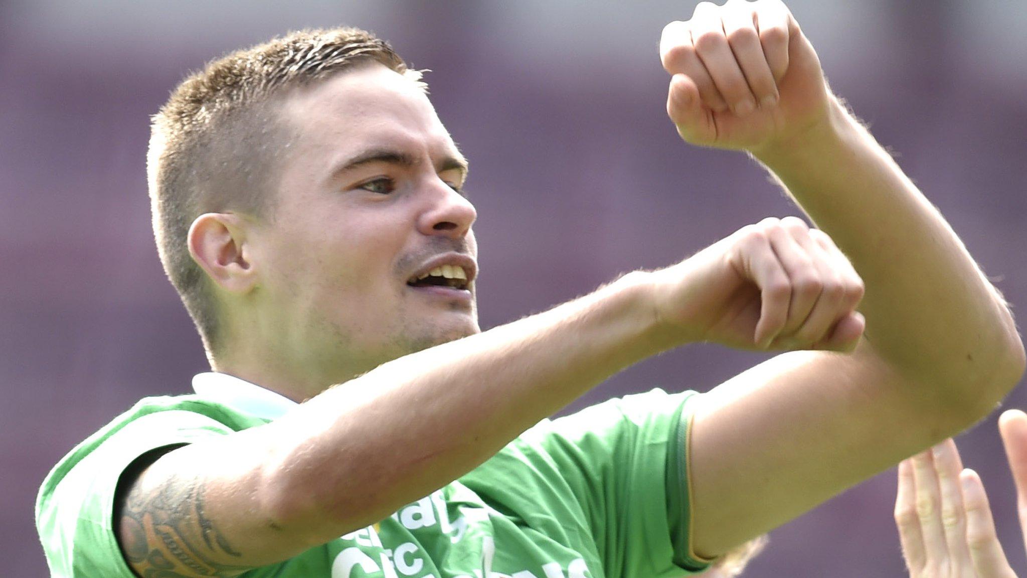 Celtic right-back Mikael Lustig celebrates at Tynecastle